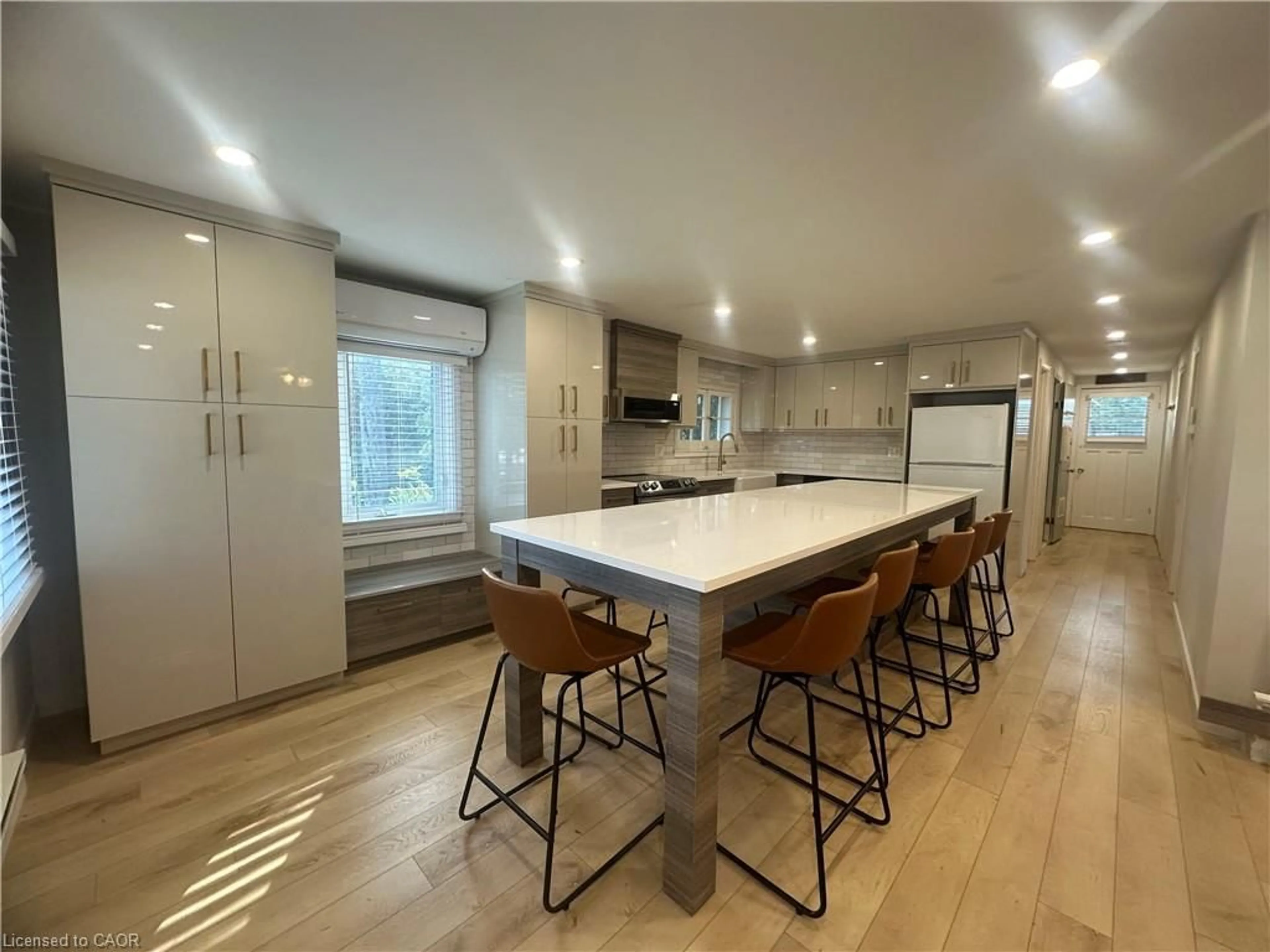 Open concept kitchen, wood/laminate floor for 115 Erie Blvd, Long Point Ontario N0E 1M0