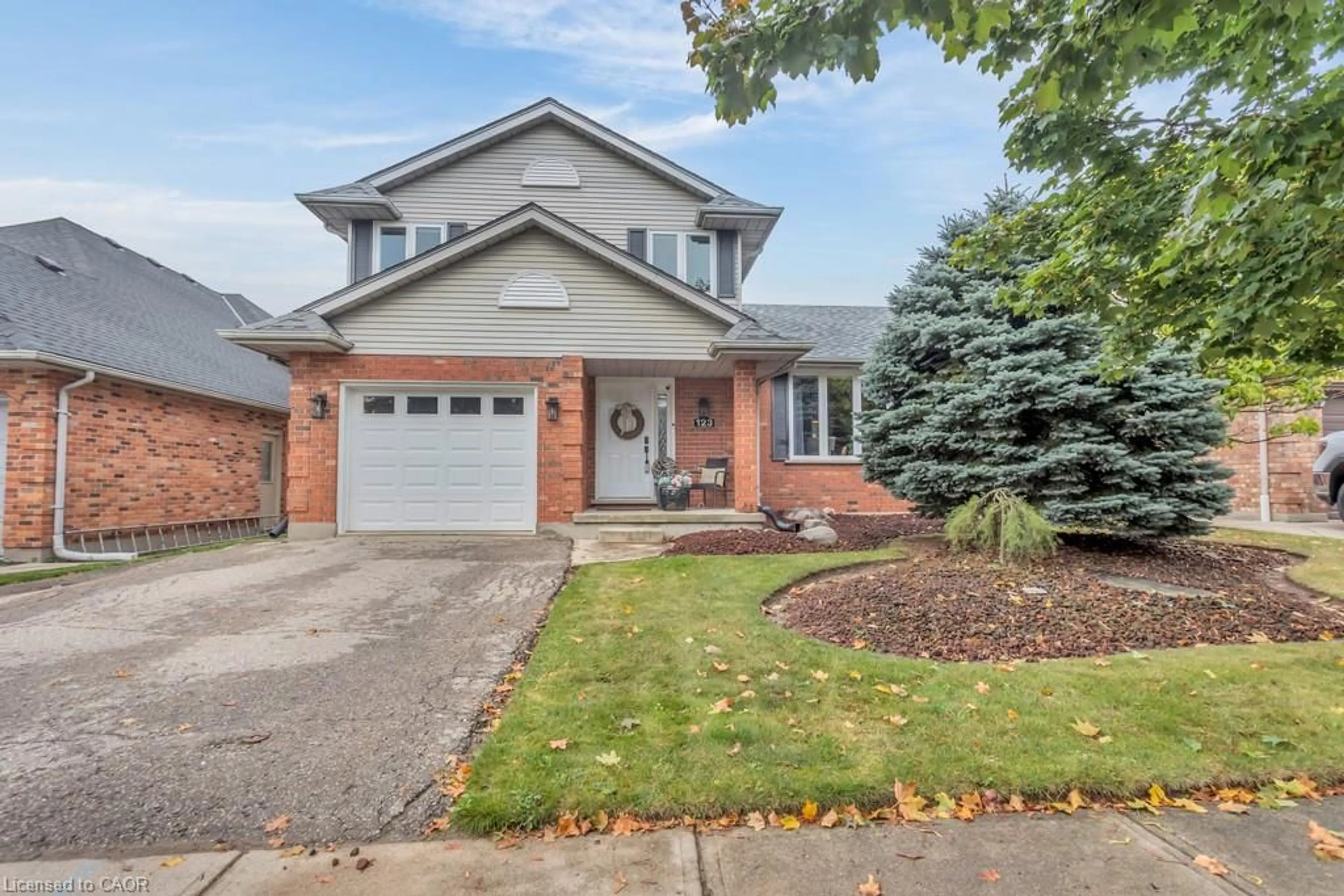 Home with brick exterior material, street for 123 John Davies Dr, Woodstock Ontario N4T 1N2