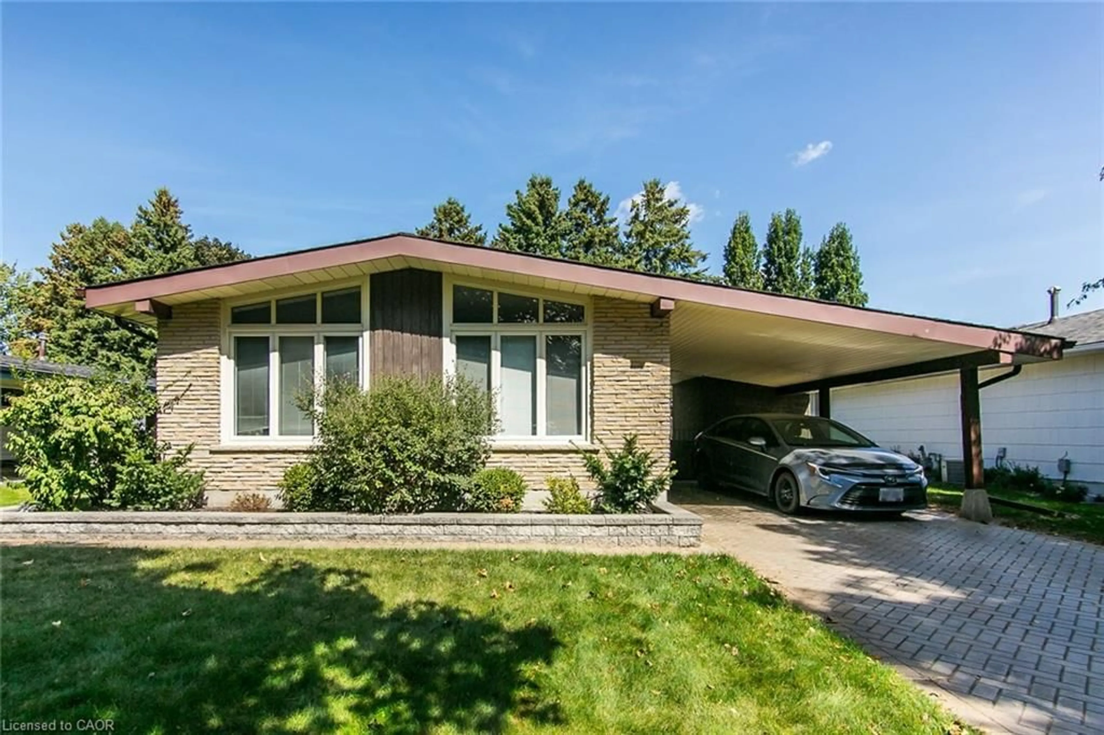 Home with brick exterior material, street for 410 Dunvegan Dr, Waterloo Ontario N2K 2C7