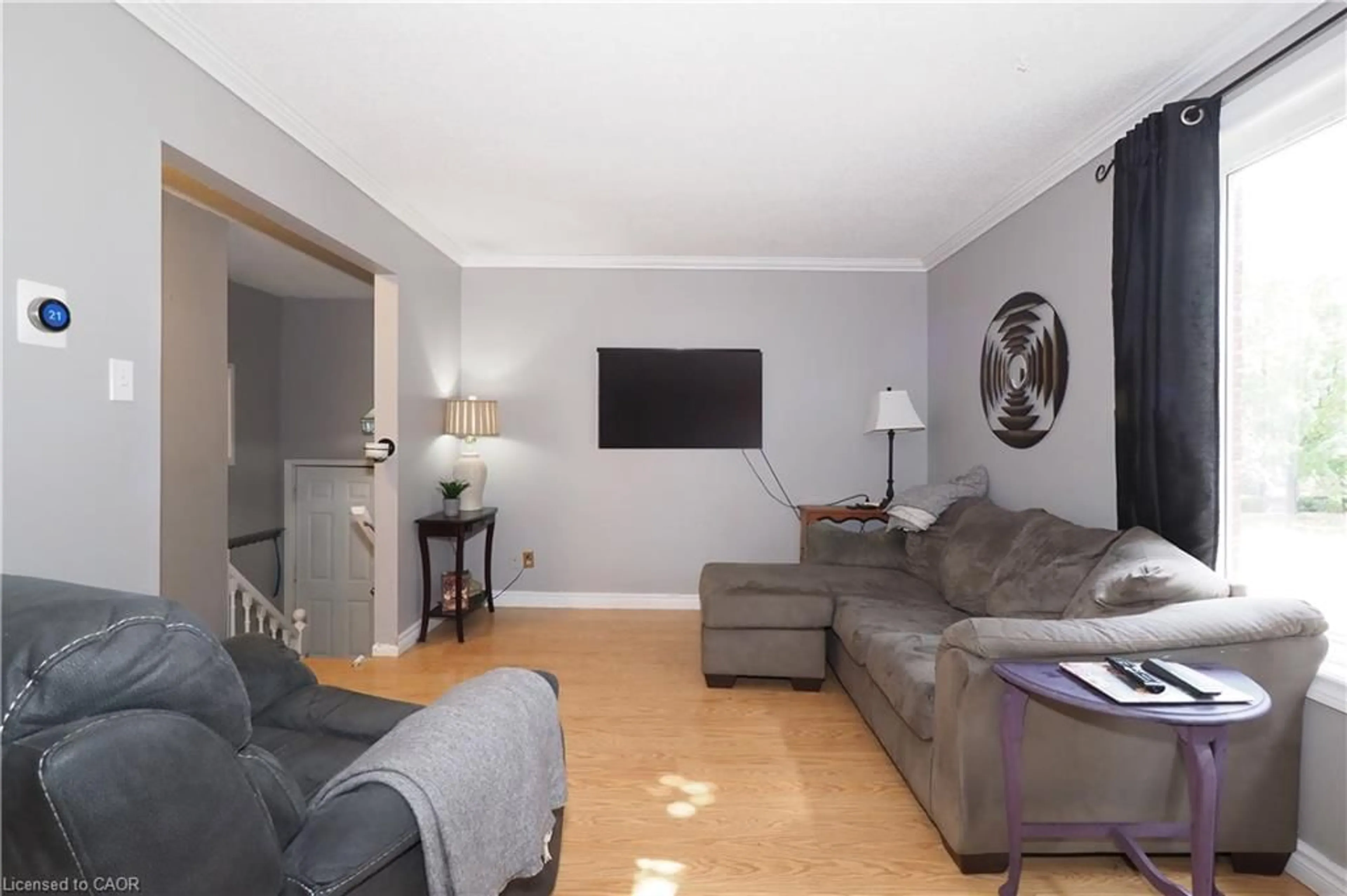 Living room with furniture, wood/laminate floor for 51 Memory Lane, Cambridge Ontario N3C 3W9