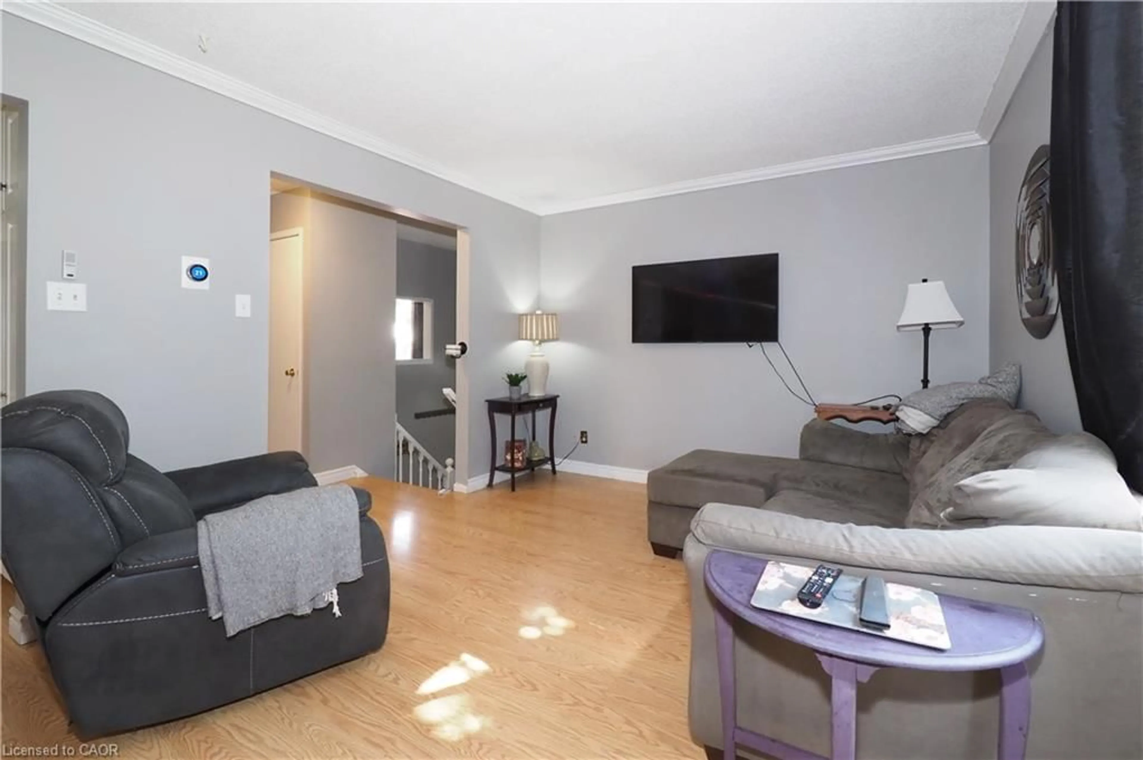 Living room with furniture, wood/laminate floor for 51 Memory Lane, Cambridge Ontario N3C 3W9