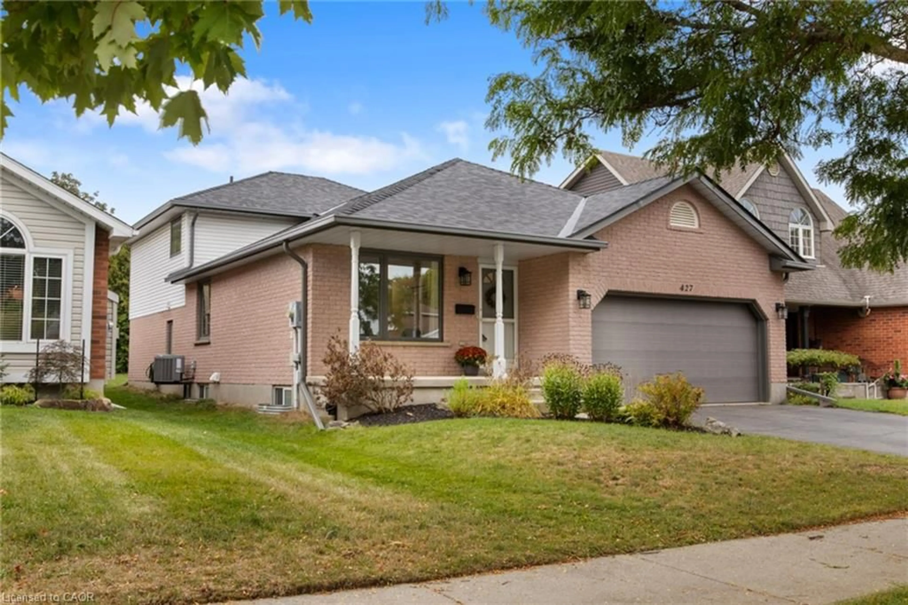 Home with brick exterior material, street for 427 Dansbury Dr, Waterloo Ontario N2K 3X9
