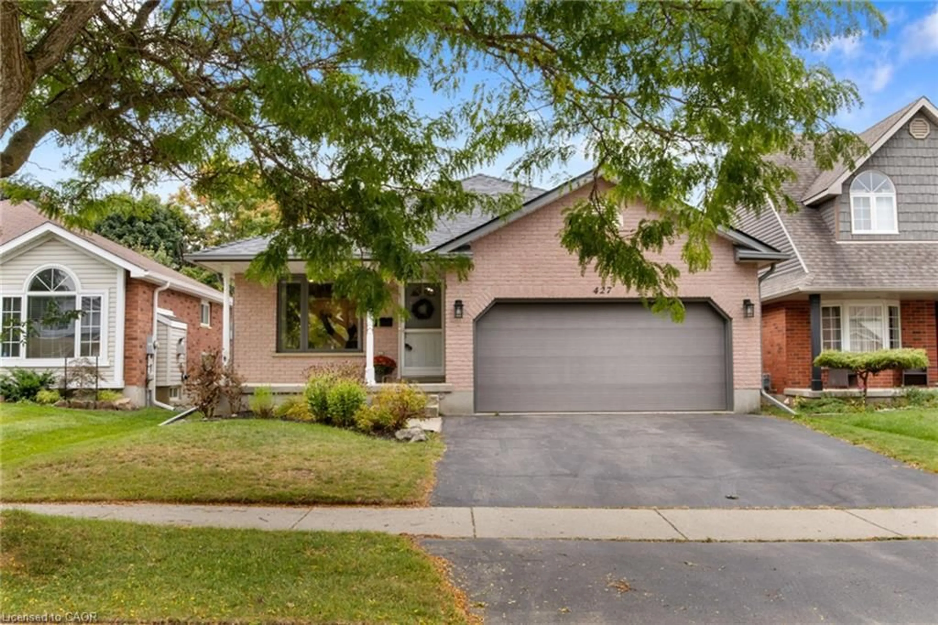 Home with brick exterior material, street for 427 Dansbury Dr, Waterloo Ontario N2K 3X9