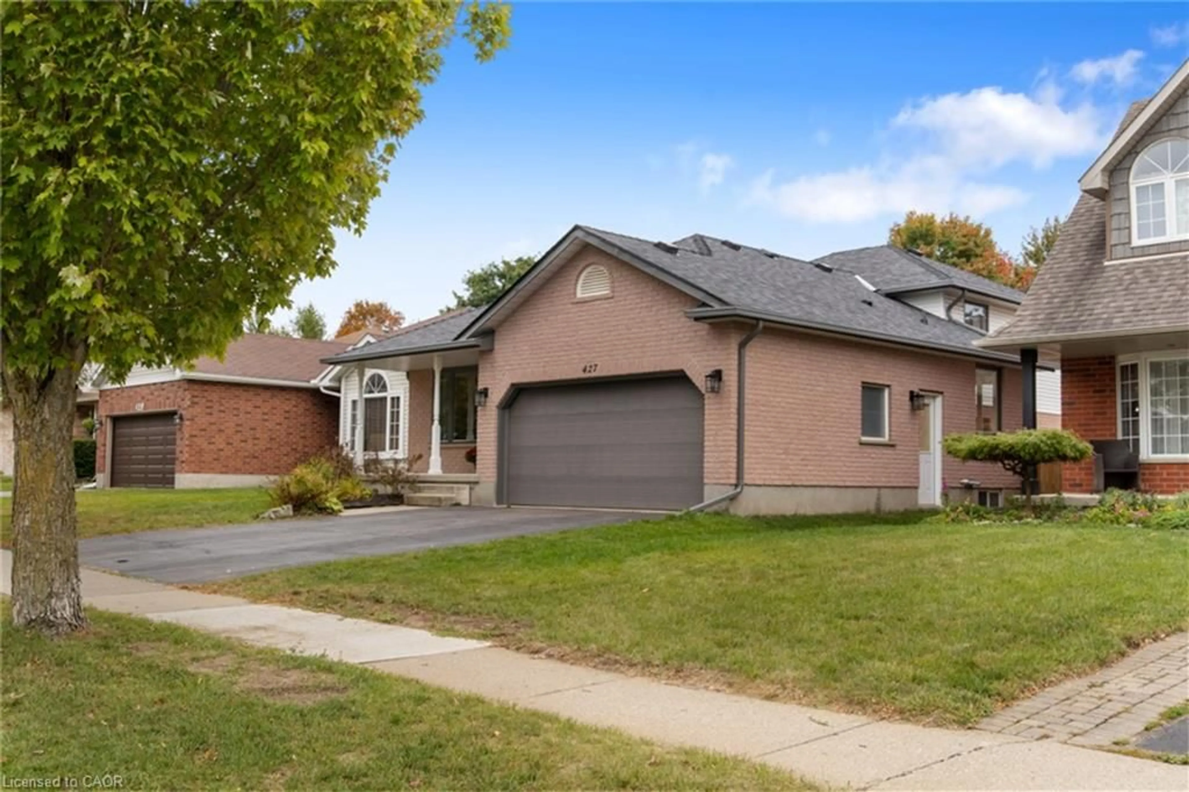 Home with brick exterior material, street for 427 Dansbury Dr, Waterloo Ontario N2K 3X9
