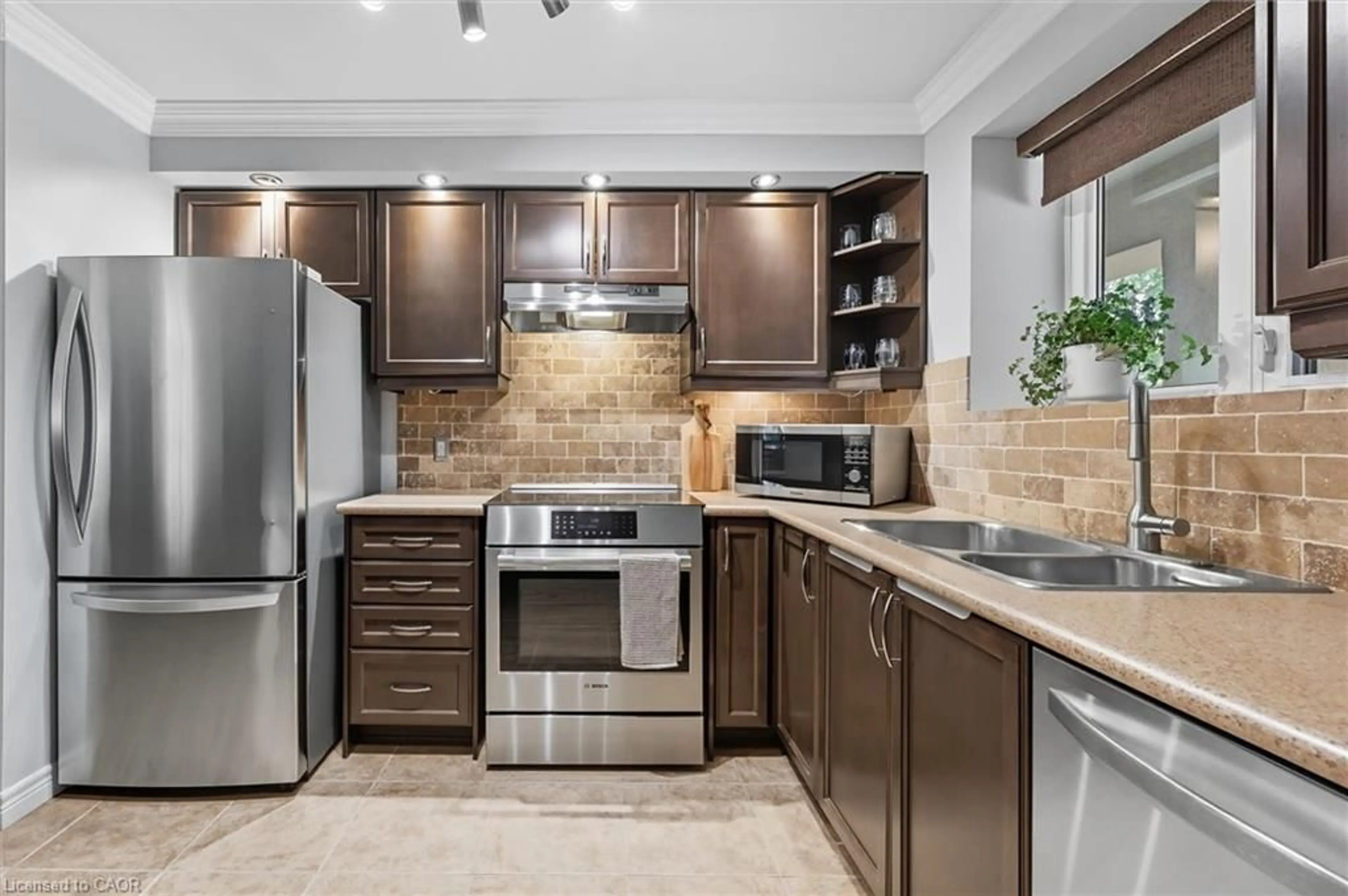 Open concept kitchen, ceramic/tile floor for 1212 Fennell Ave #304, Hamilton Ontario L8T 1T2