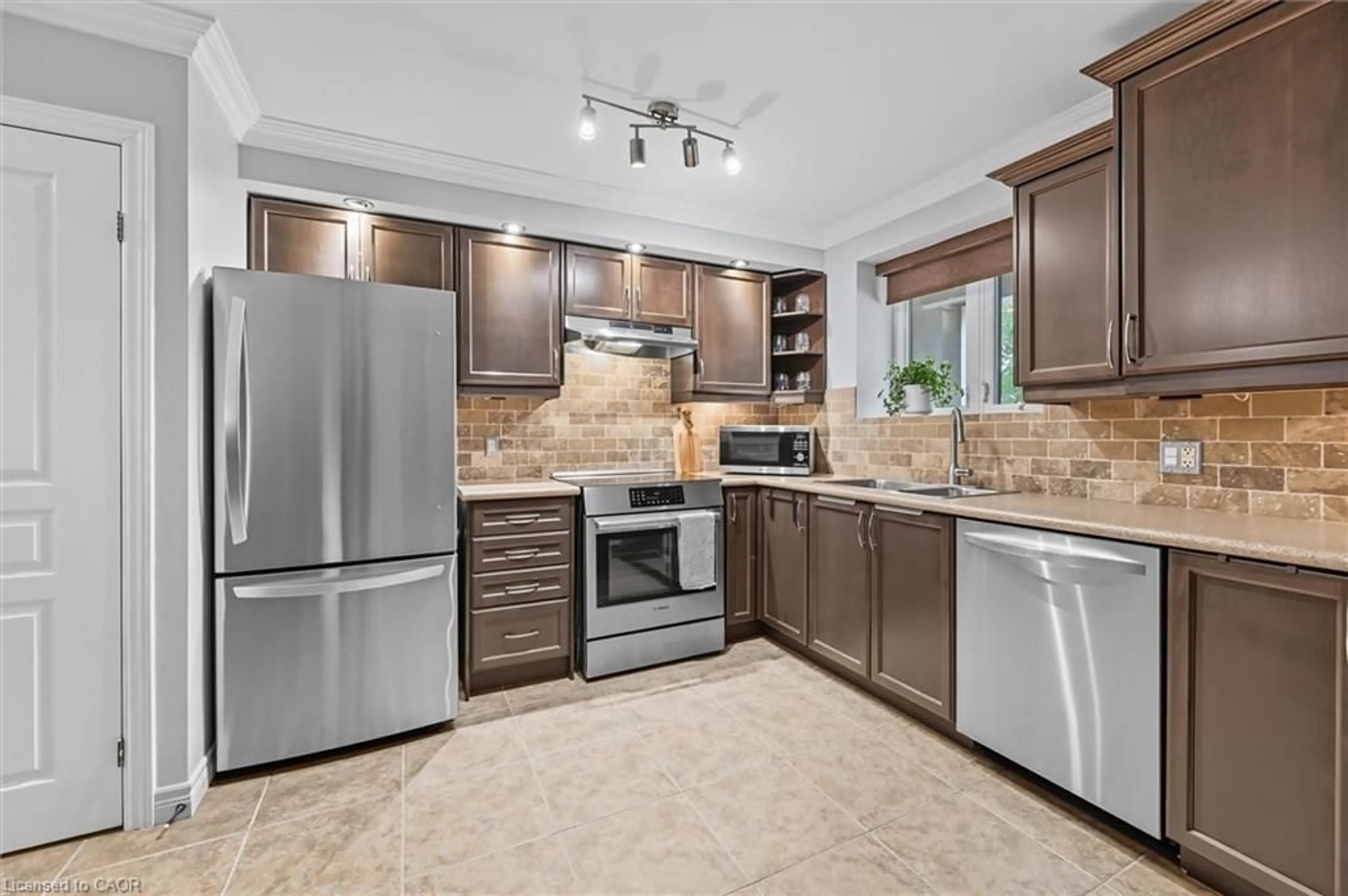 Open concept kitchen, ceramic/tile floor for 1212 Fennell Ave #304, Hamilton Ontario L8T 1T2