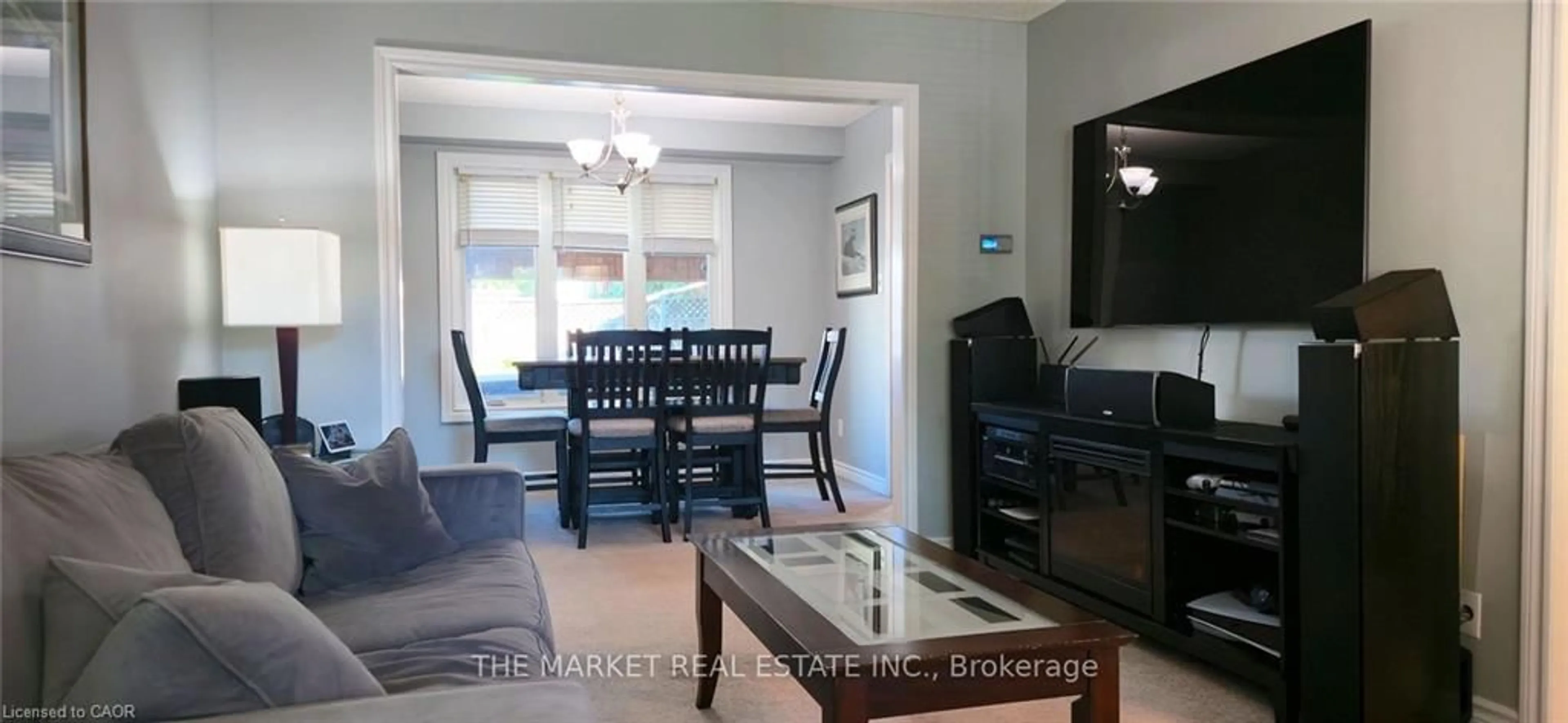 Living room with furniture, wood/laminate floor for 233 Acadia Dr, Hamilton Ontario L8W 3L1