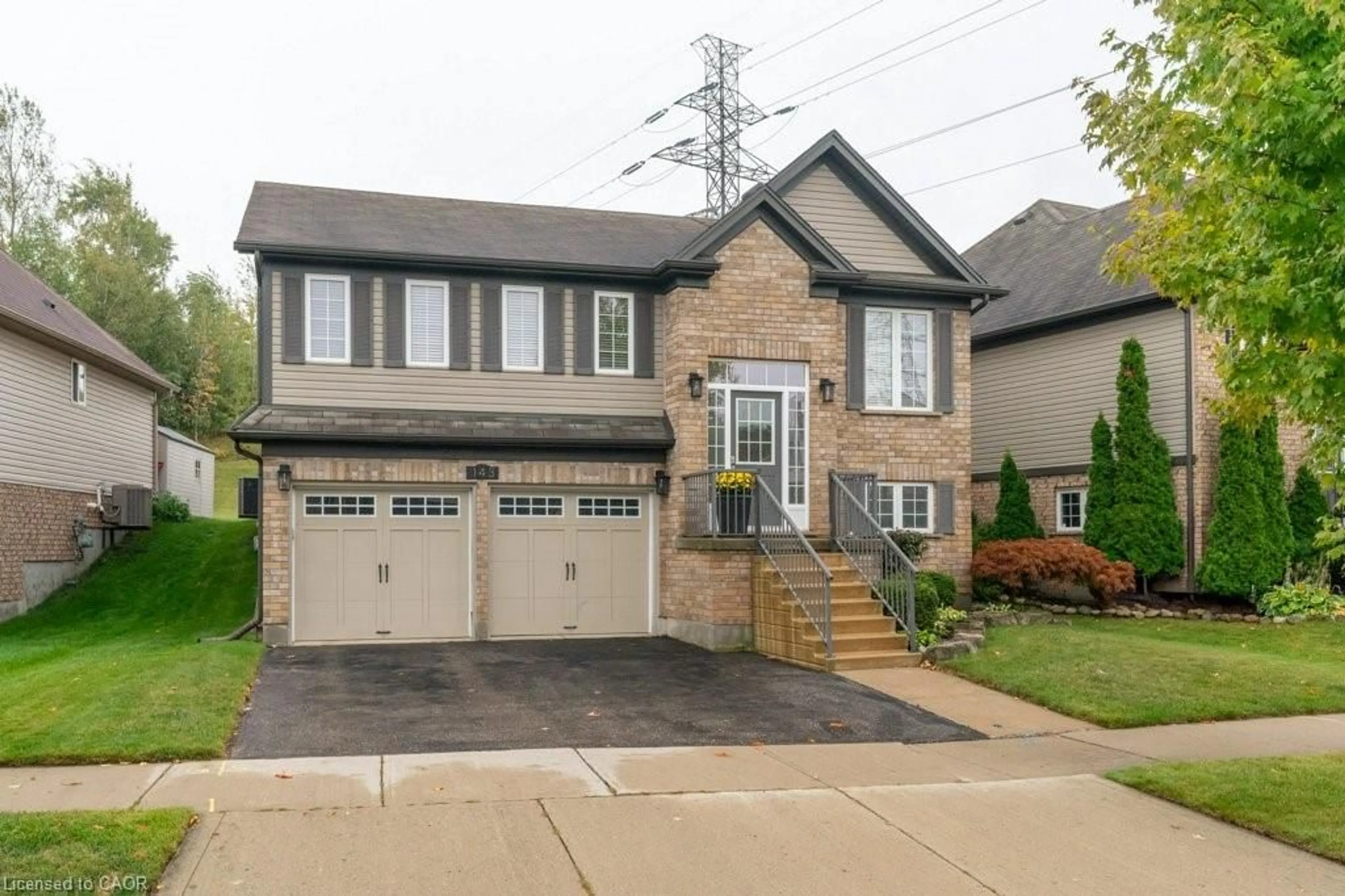 Home with brick exterior material, street for 143 Isaiah Dr, Kitchener Ontario N2E 0B6
