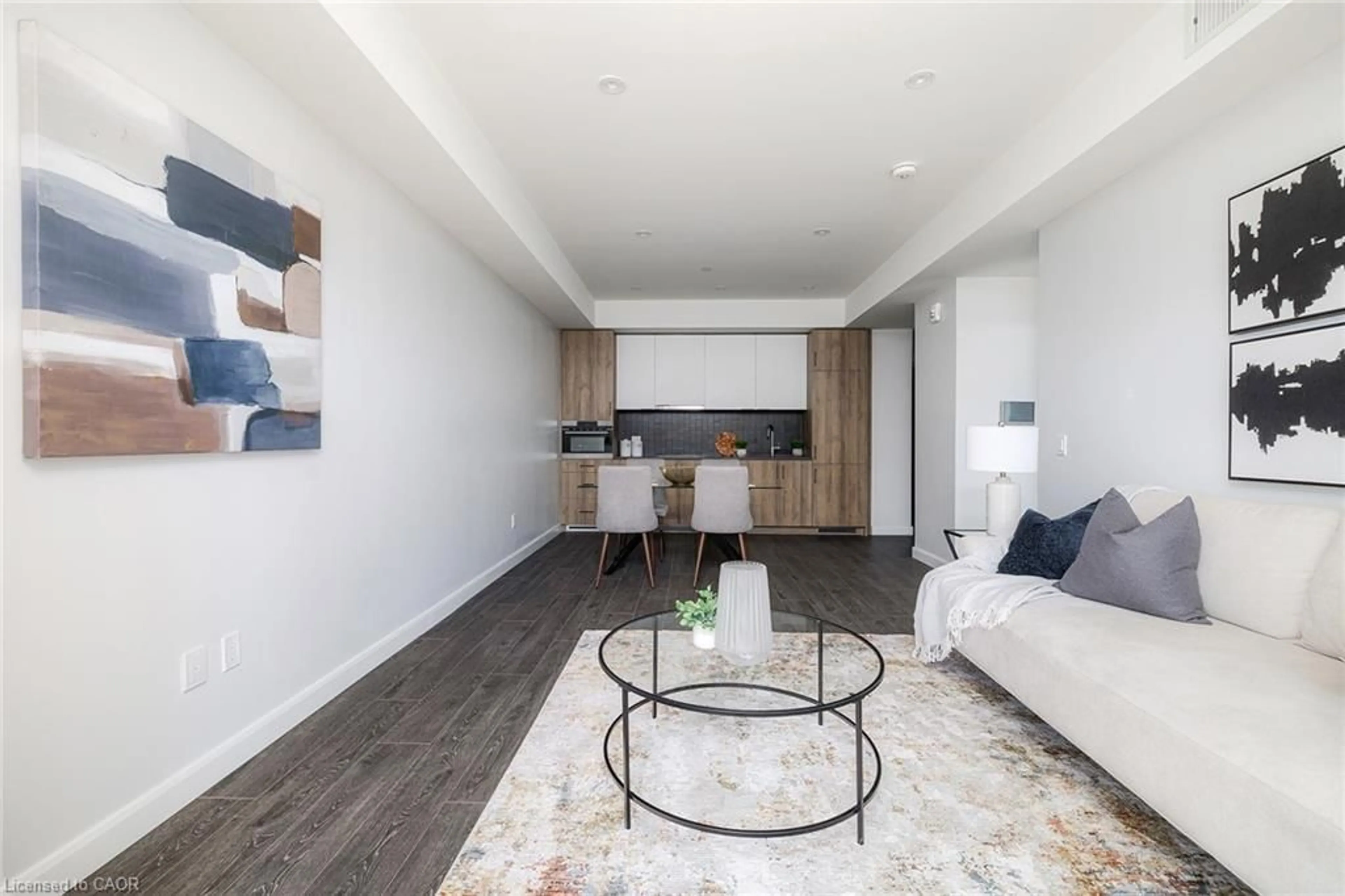 Living room with furniture, wood/laminate floor for 741 King St #408, Kitchener Ontario N2G 0E9