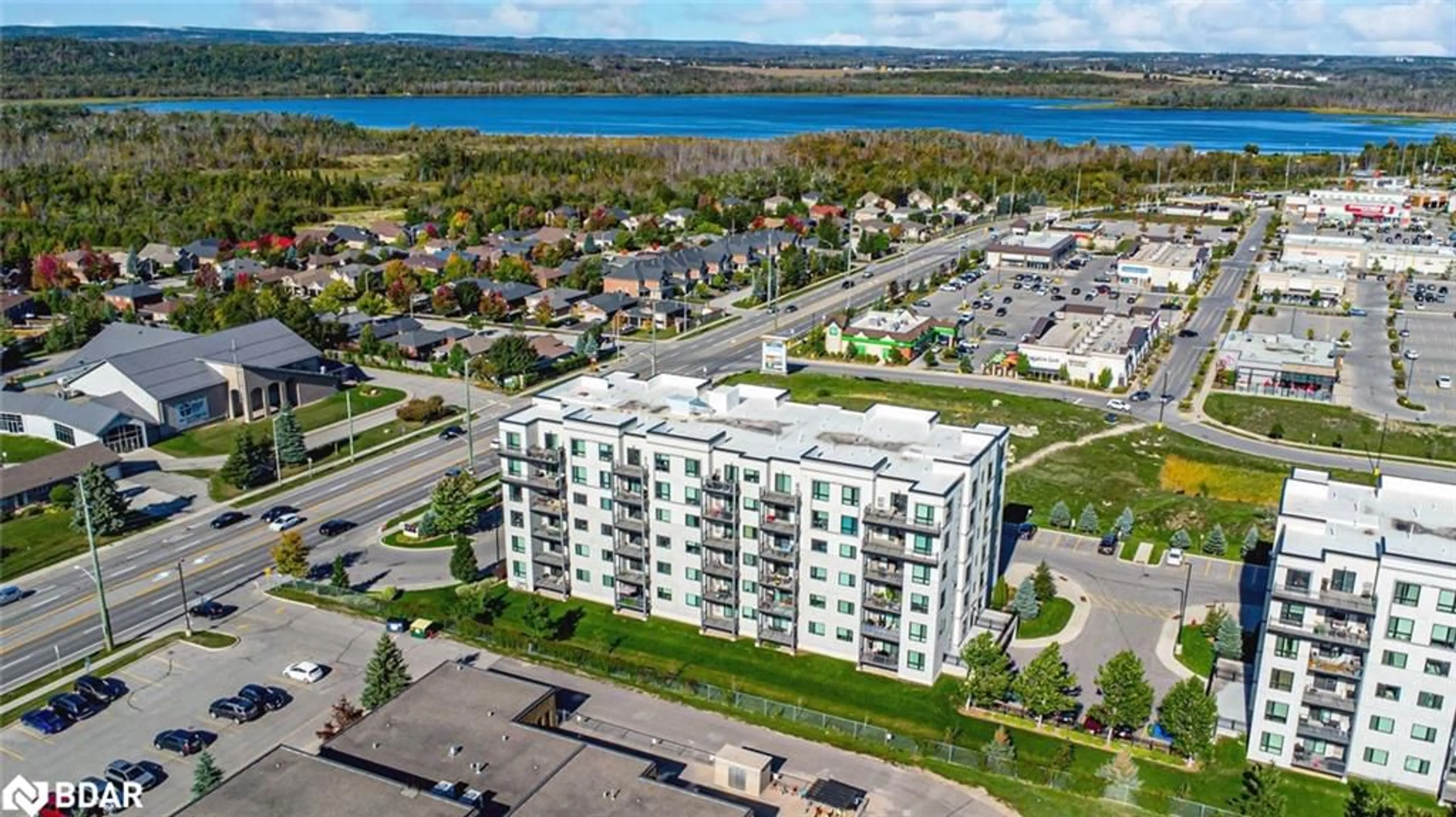 A pic from outside/outdoor area/front of a property/back of a property/a pic from drone, unknown for 295 Cundles Road East #404, Barrie Ontario L4M 0K8