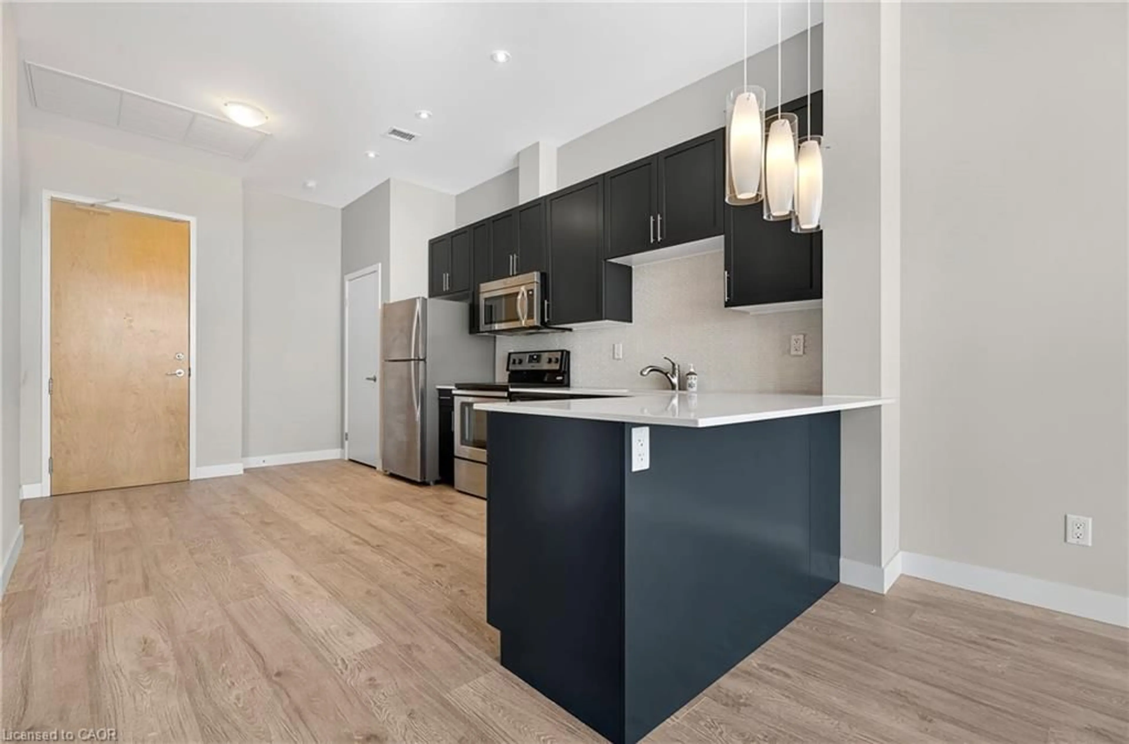 Open concept kitchen, wood/laminate floor for 1 Victoria Street South St #1804, Kitchener Ontario N2G 0B5