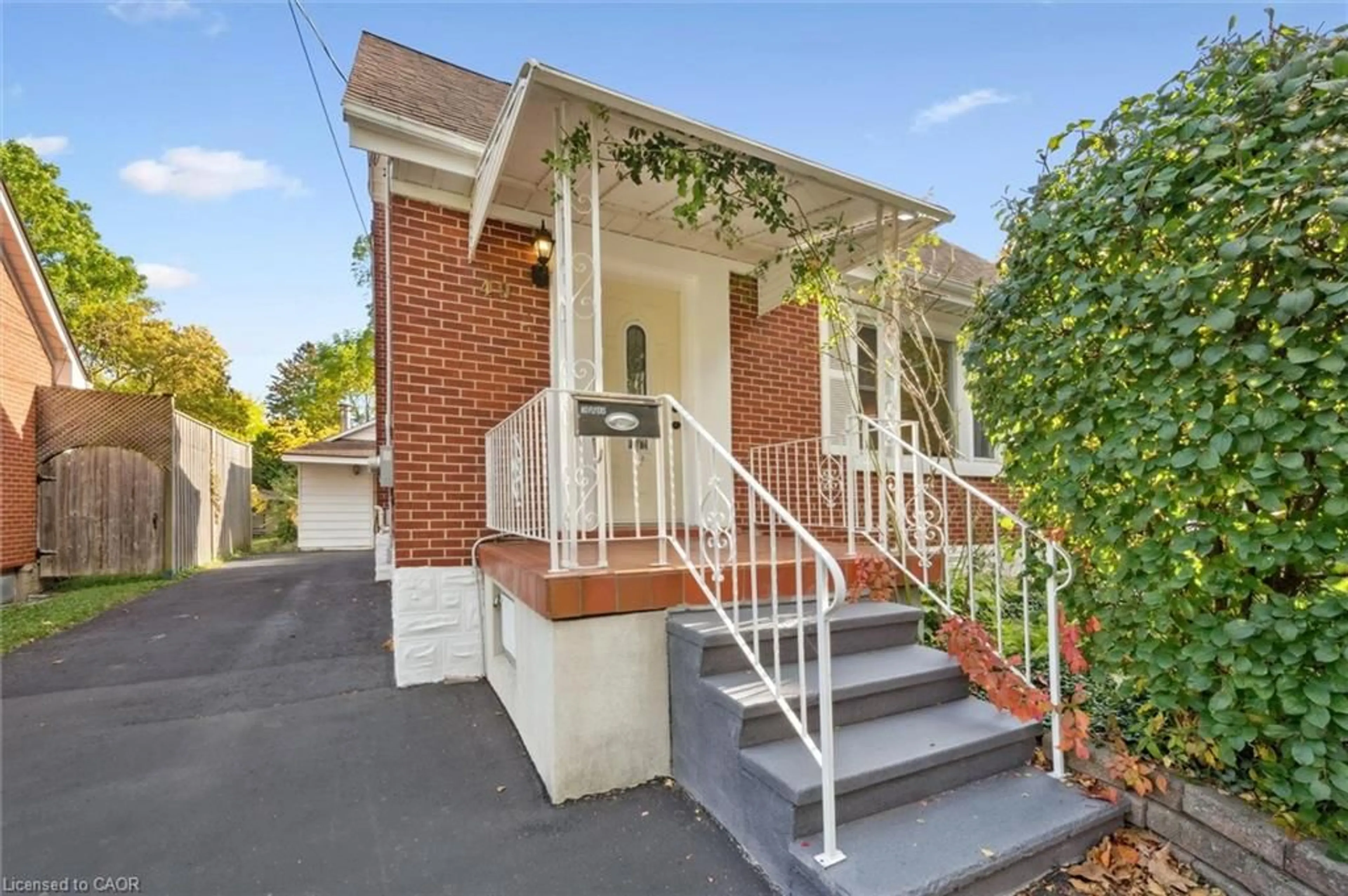 Home with brick exterior material, street for 49 Woodland Ave, Kitchener Ontario N2M 3G8