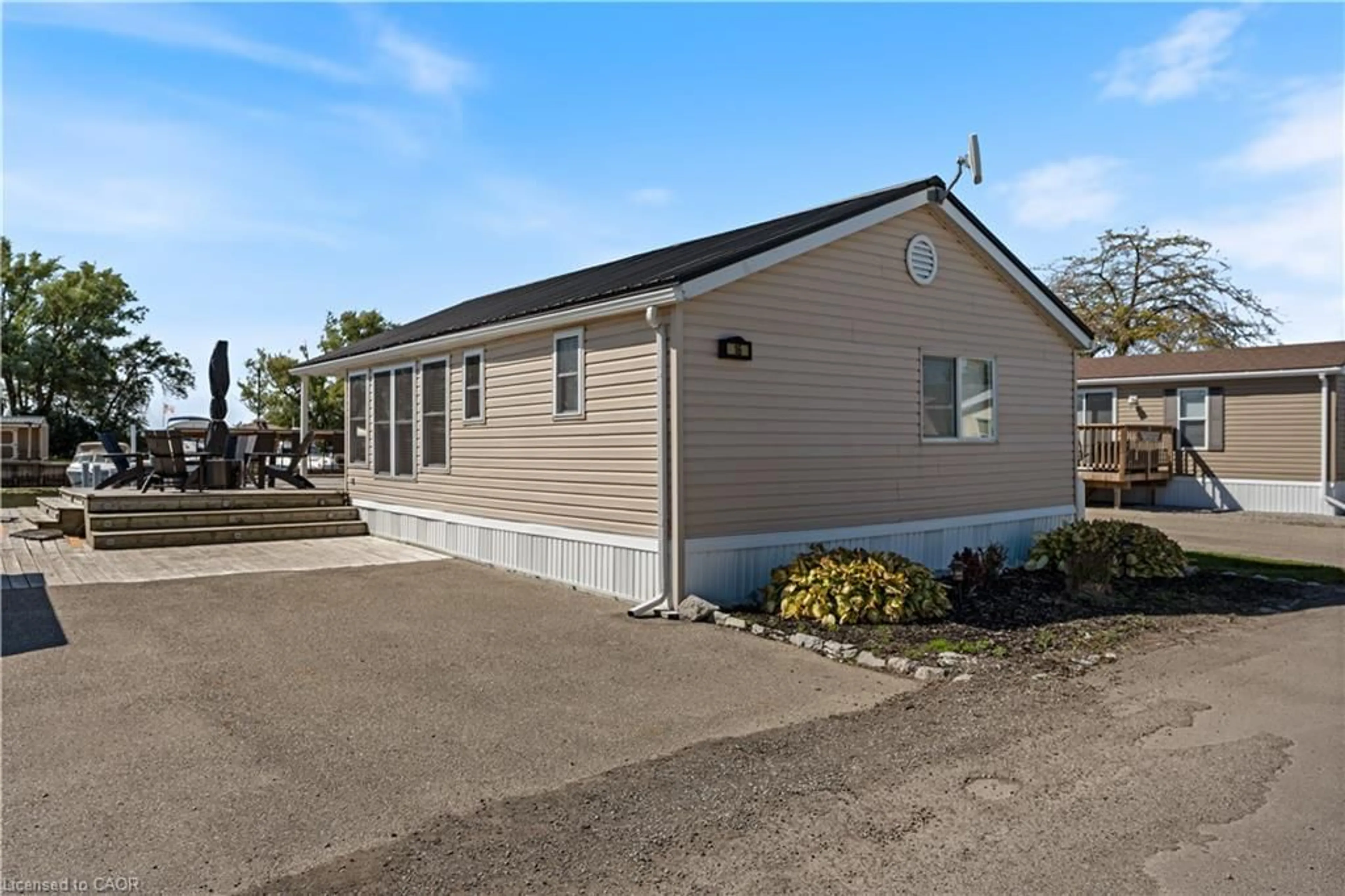 Home with vinyl exterior material, street for 92 Clubhouse Rd #16, Turkey Point Ontario N0E 1T0