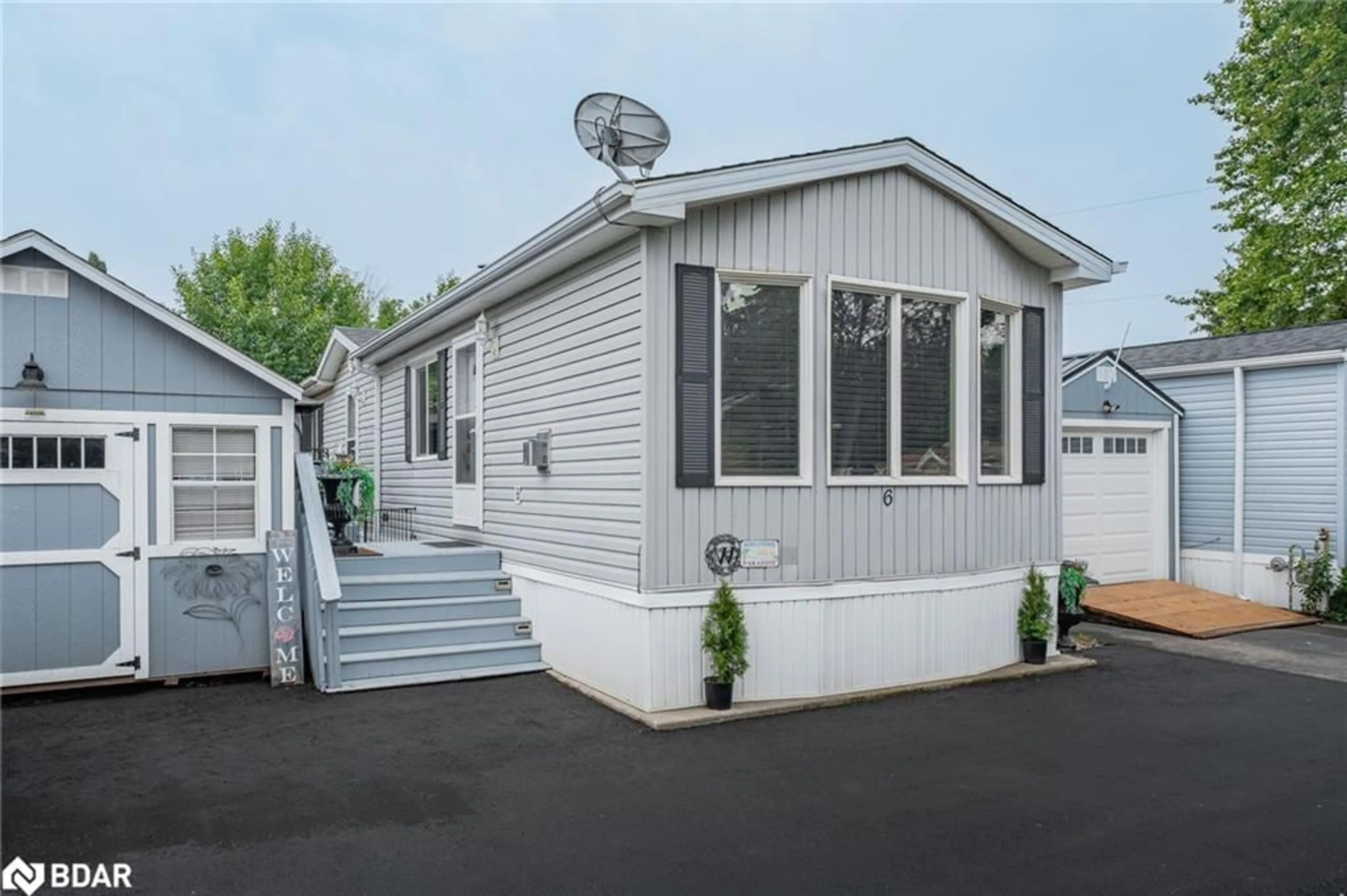 Home with vinyl exterior material, street for 6 Water Street Pvt, Puslinch Ontario N1H 6H9