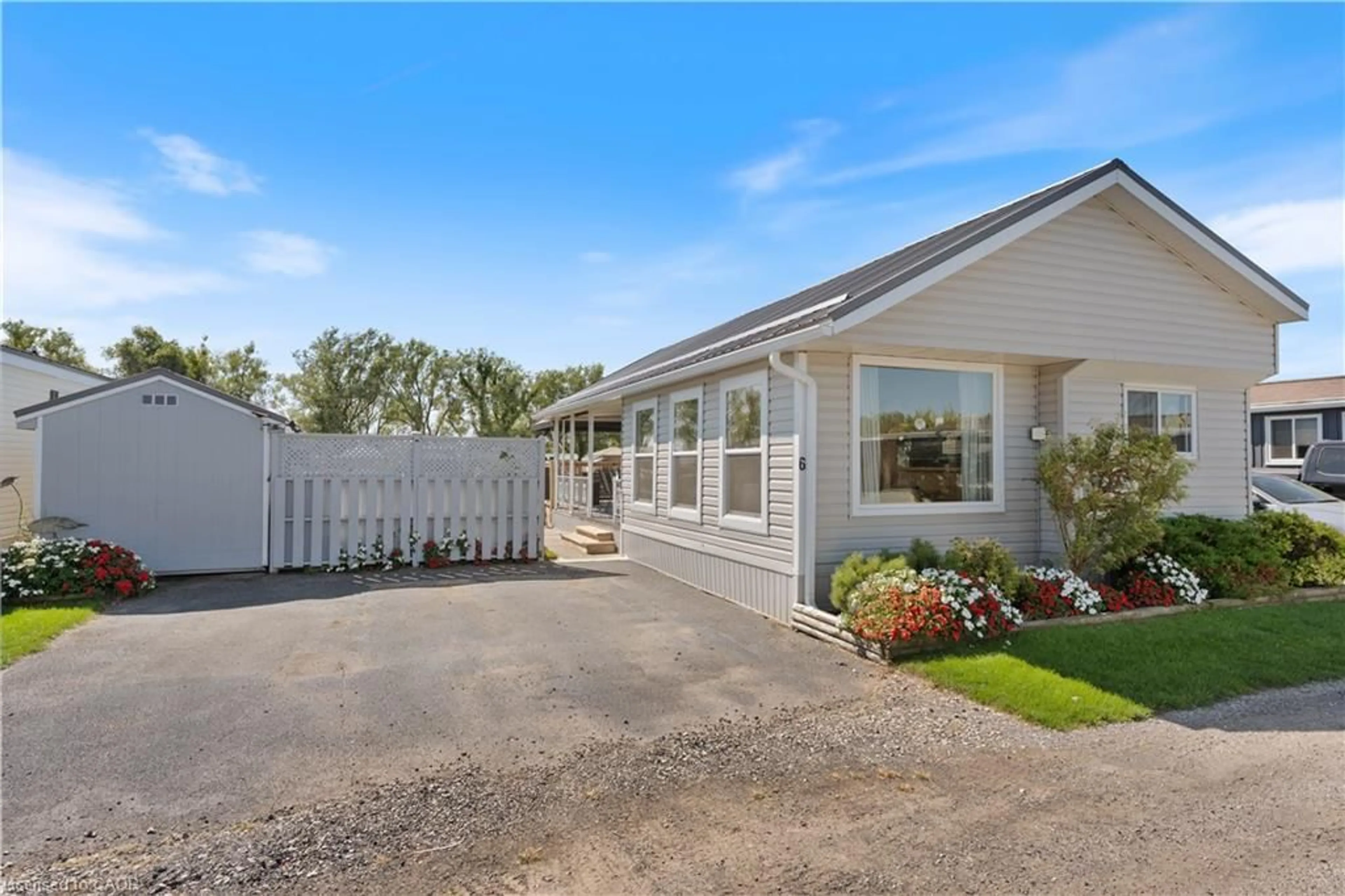 A pic from outside/outdoor area/front of a property/back of a property/a pic from drone, street for 92 Clubhouse Rd #6, Turkey Point Ontario N0E 1T0