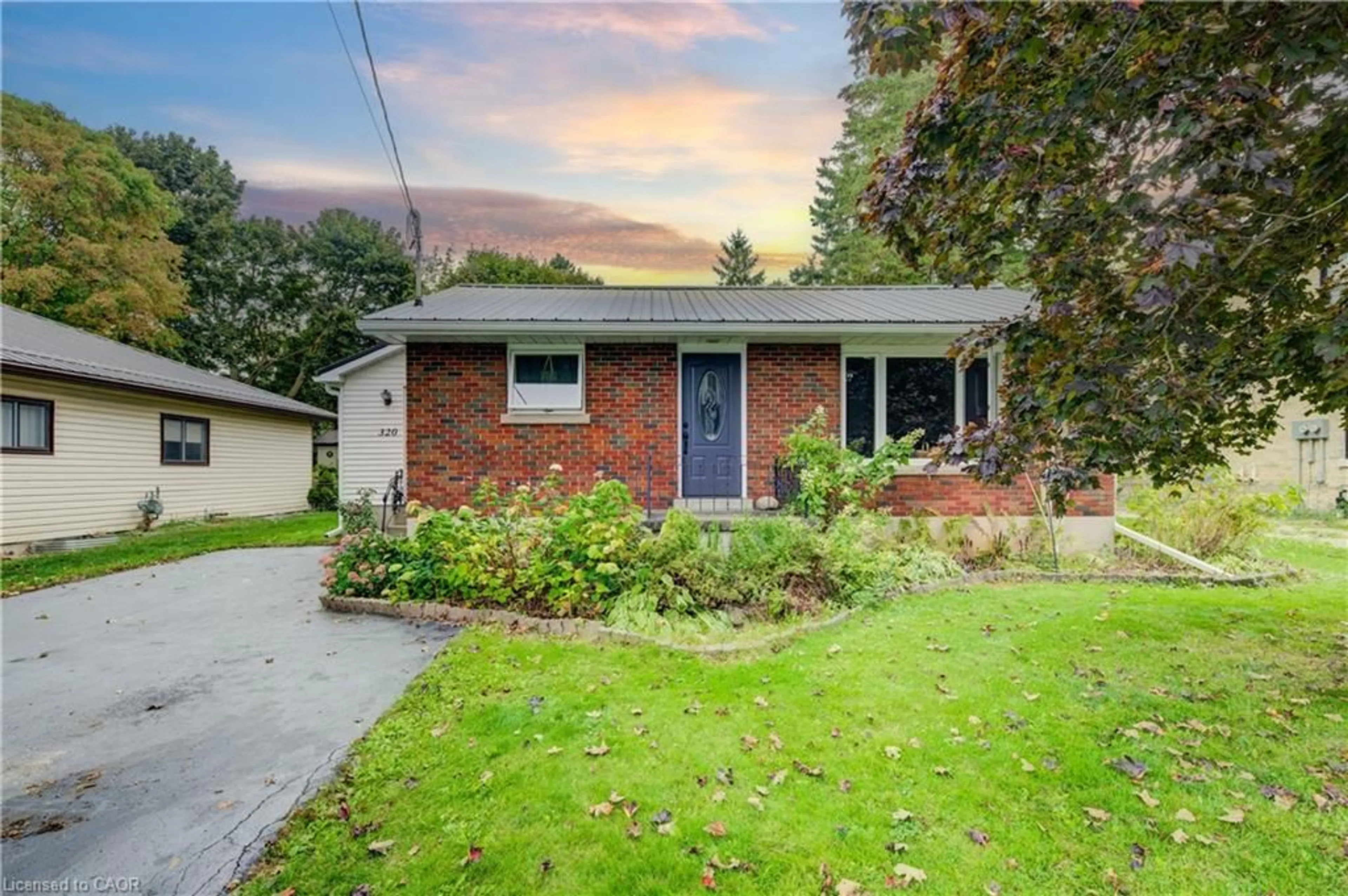 Home with brick exterior material, street for 320 William St, Mount Forest Ontario N0G 2L3