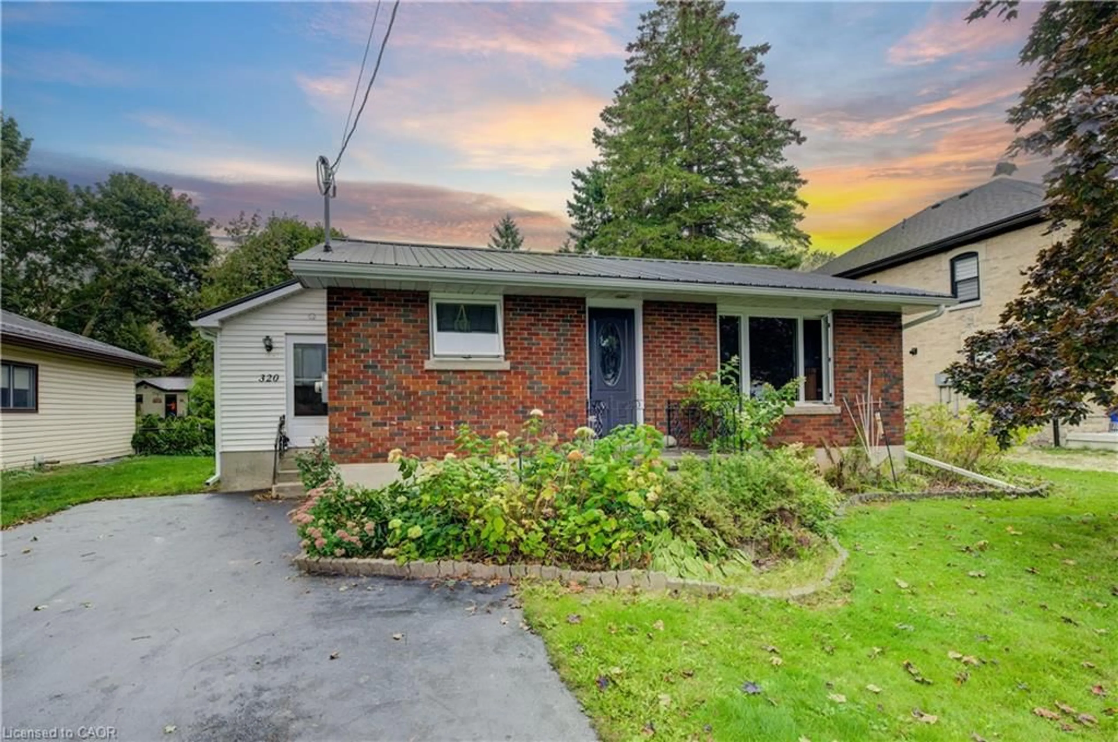 Home with brick exterior material, street for 320 William St, Mount Forest Ontario N0G 2L3