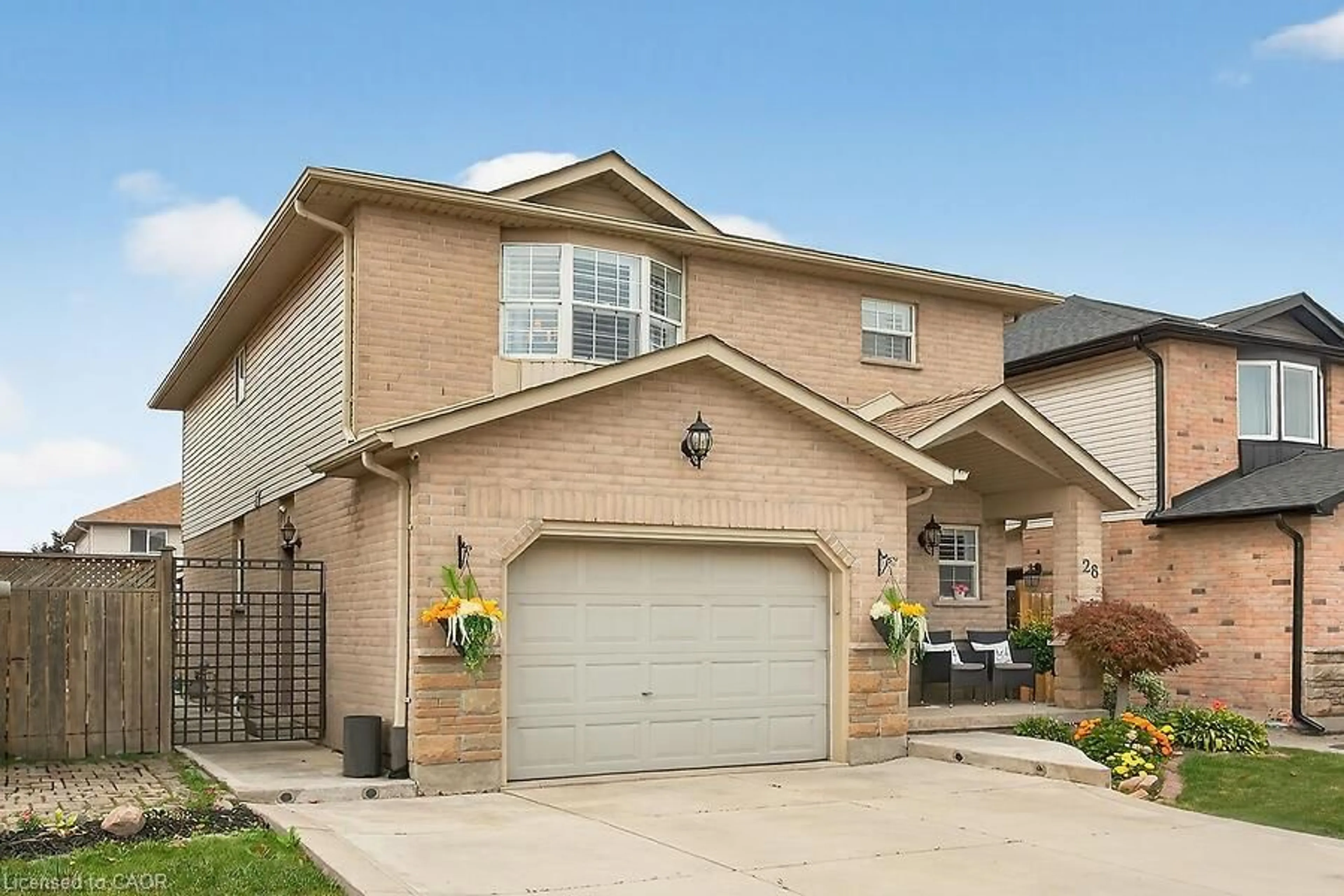 Home with brick exterior material, street for 28 Woodbank St, Hamilton Ontario L8J 3Y4