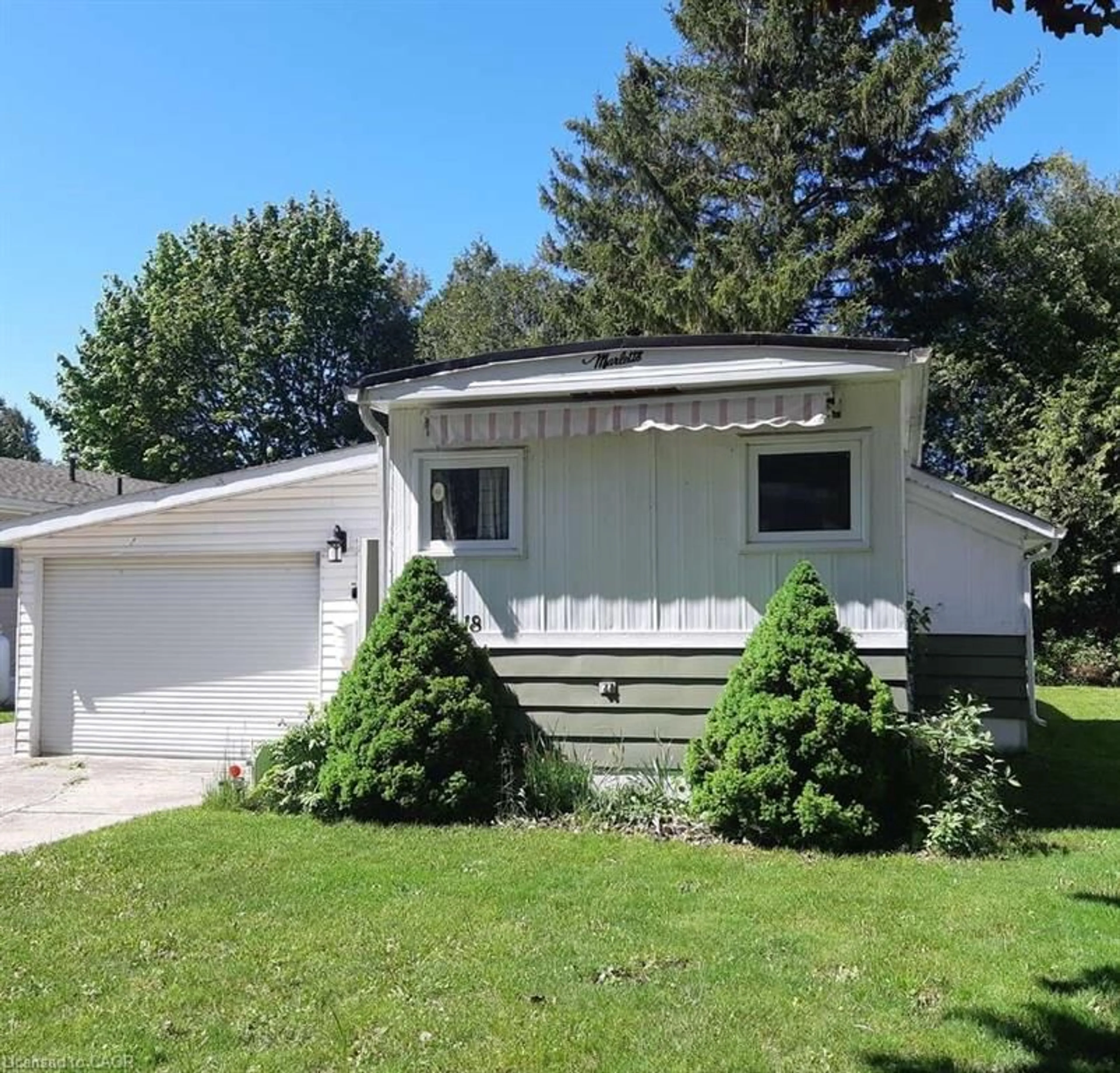 Home with vinyl exterior material, street for 18 Sutton Dr, Goderich Ontario N7A 3Y3
