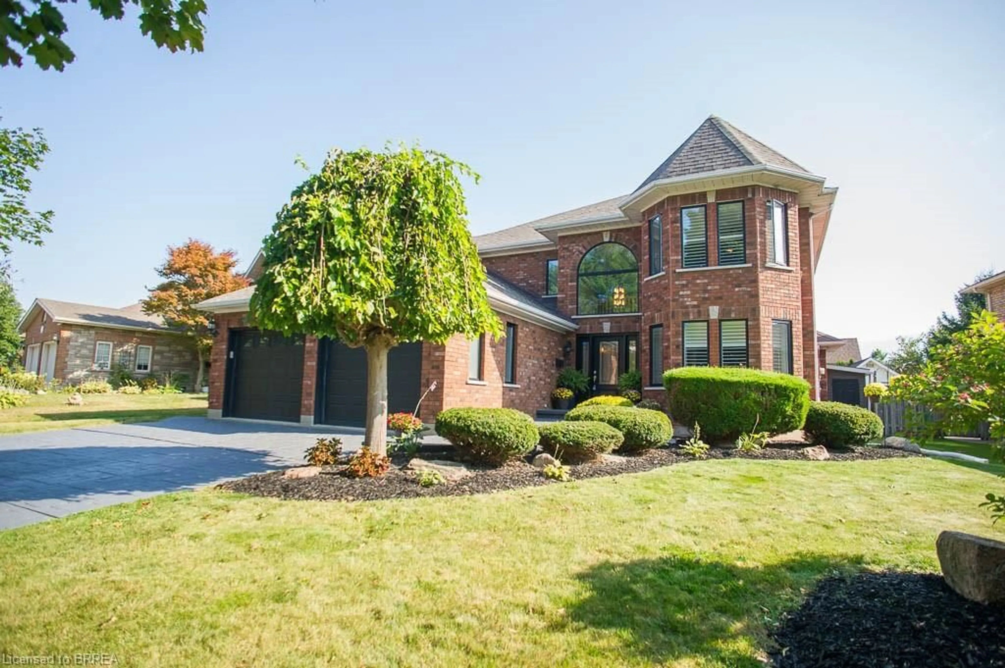 Home with brick exterior material, street for 54 Blackfriar Lane, Brantford Ontario N3R 7L3