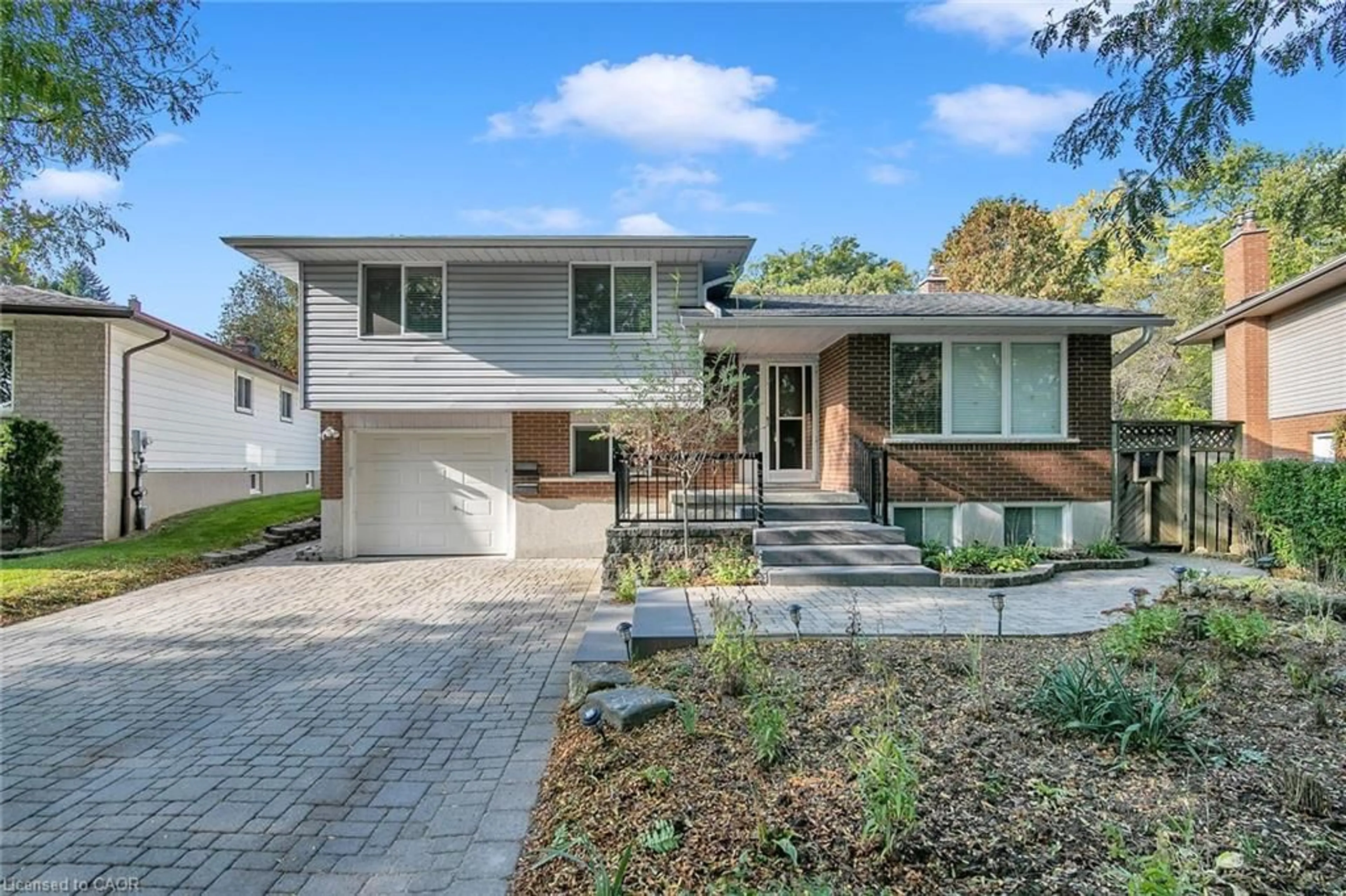 Home with brick exterior material, street for 22 Thistle Rd, Guelph Ontario N1H 6S8