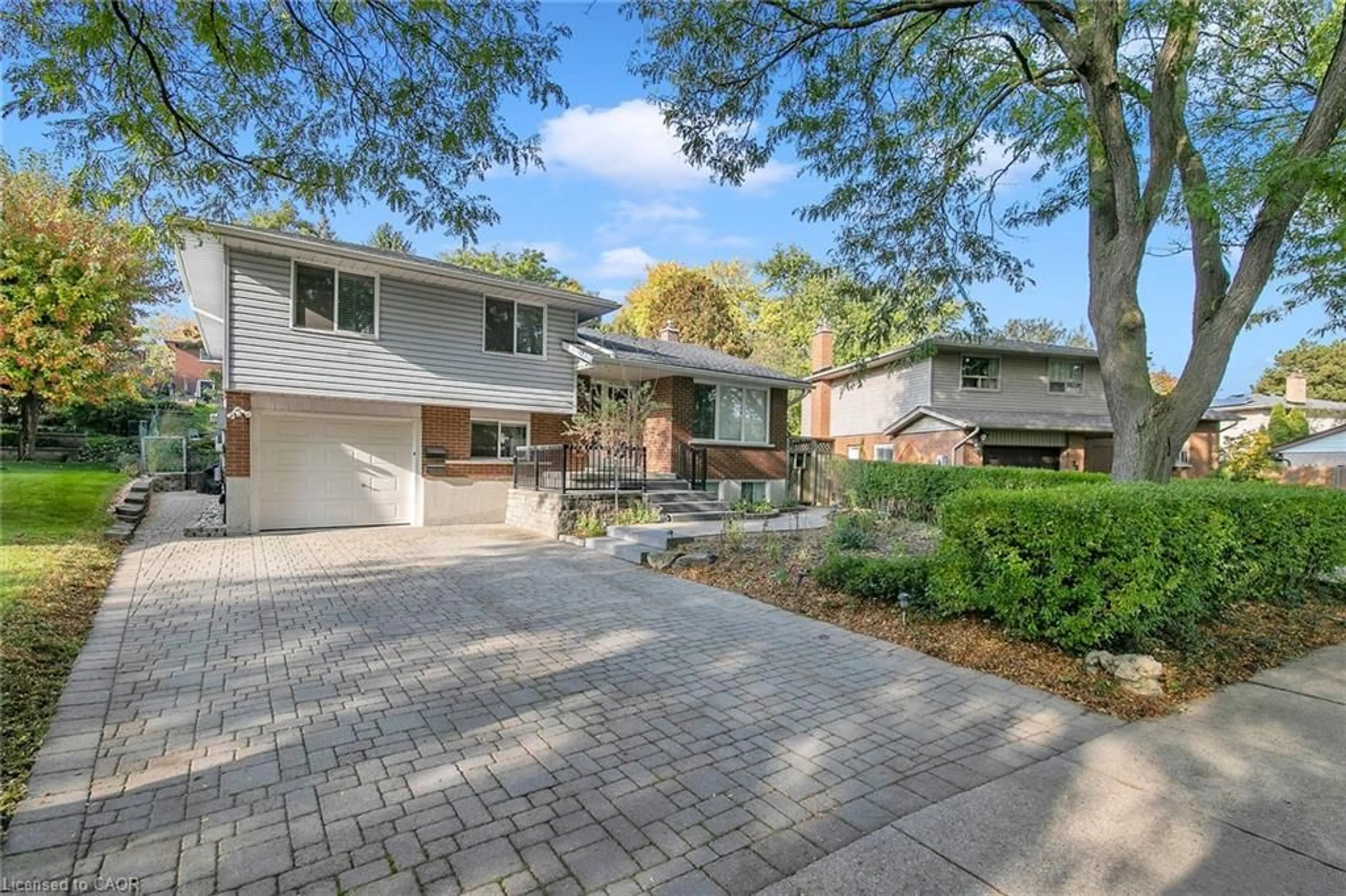 Home with brick exterior material, street for 22 Thistle Rd, Guelph Ontario N1H 6S8
