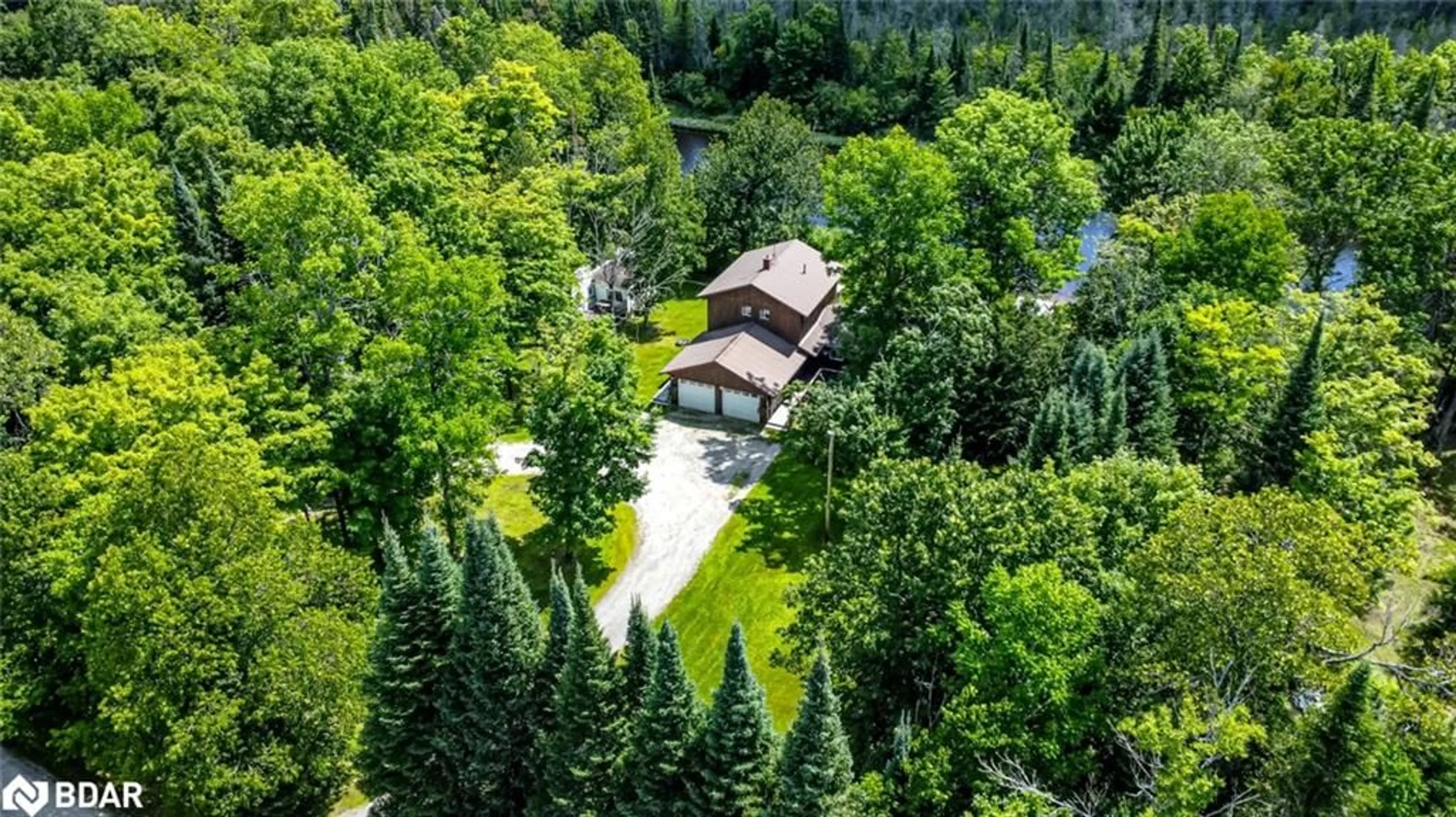 A pic from outside/outdoor area/front of a property/back of a property/a pic from drone, forest/trees view for 483 Spring Hill Rd, Burk's Falls Ontario P0A 1C0