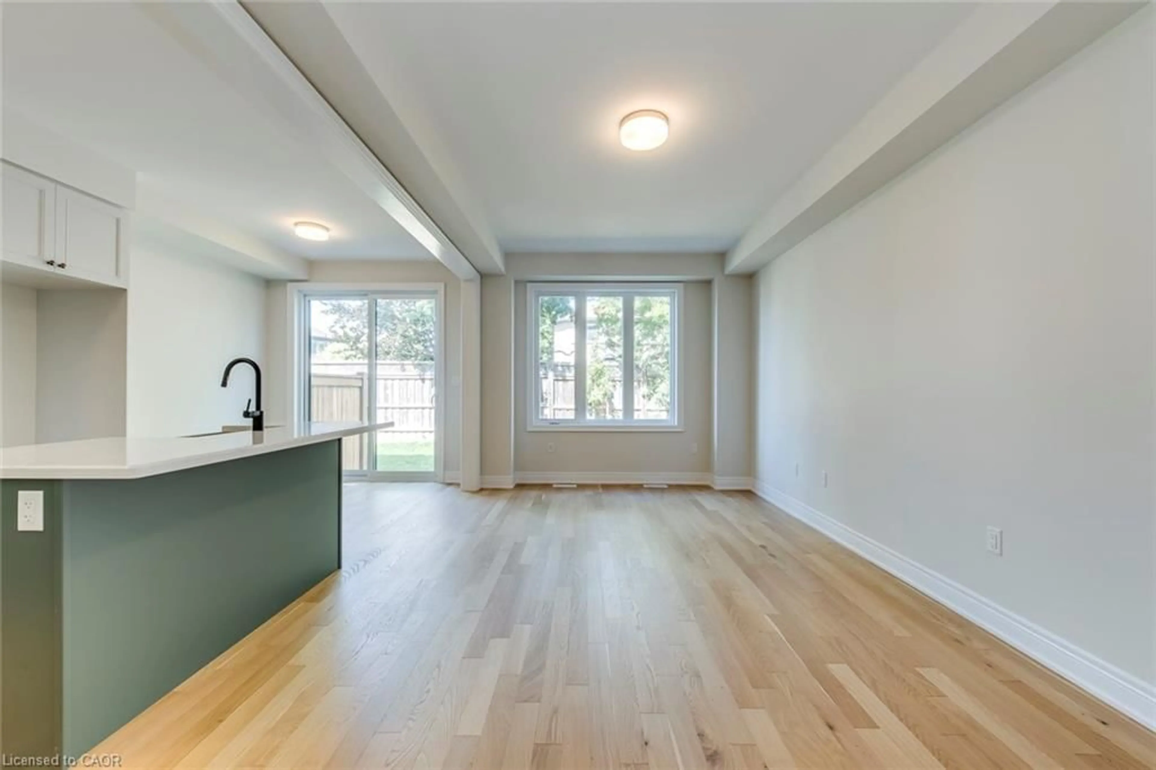 Open concept kitchen, wood/laminate floor for 2184 Postmaster Dr #19, Oakville Ontario L6M 4E6