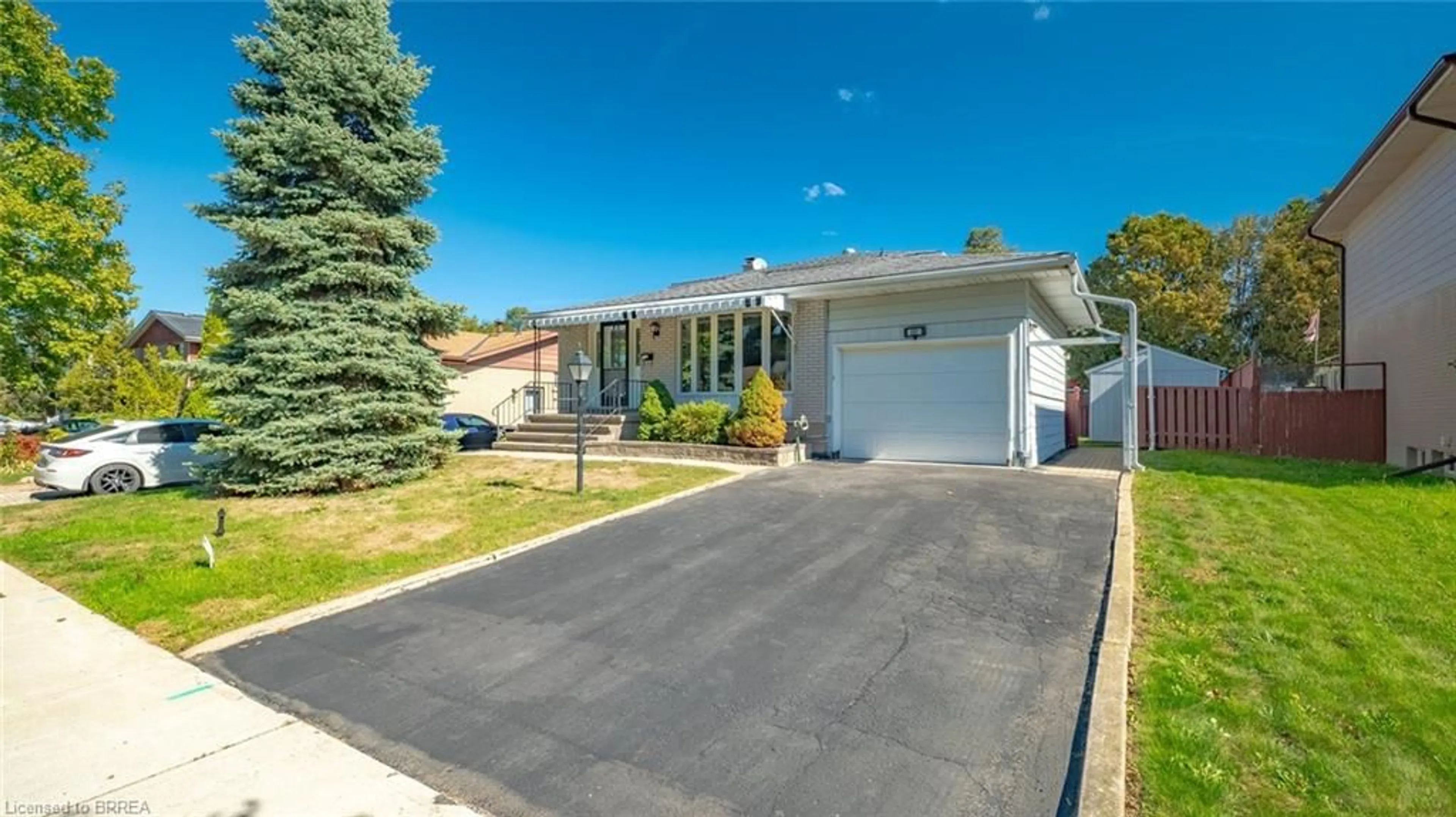 Home with vinyl exterior material, street for 15 Acorn Lane, Brantford Ontario N3R 3P3