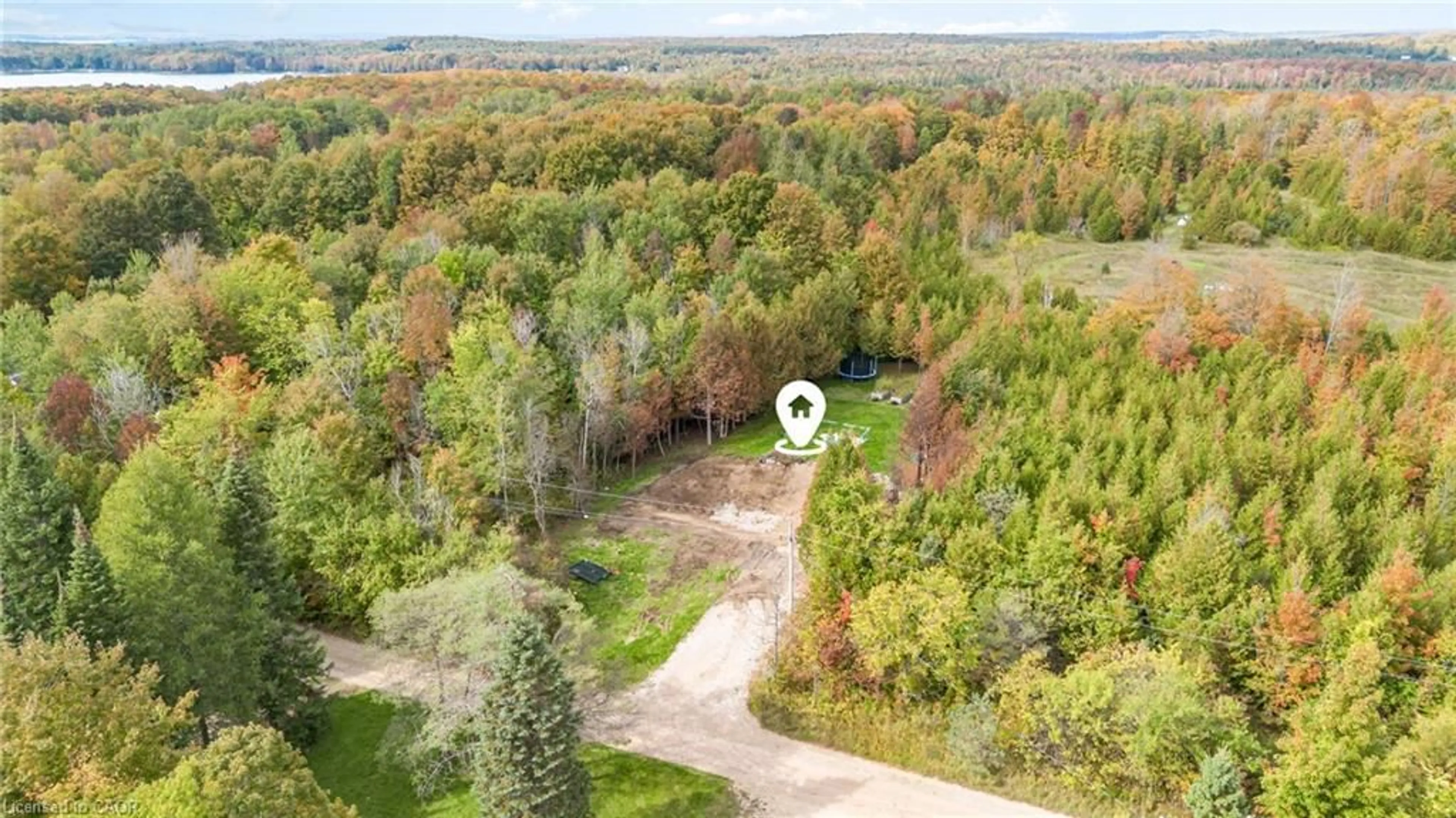 A pic from outside/outdoor area/front of a property/back of a property/a pic from drone, forest/trees view for 135 Sir Williams Lane, Flesherton Ontario N0C 1E0