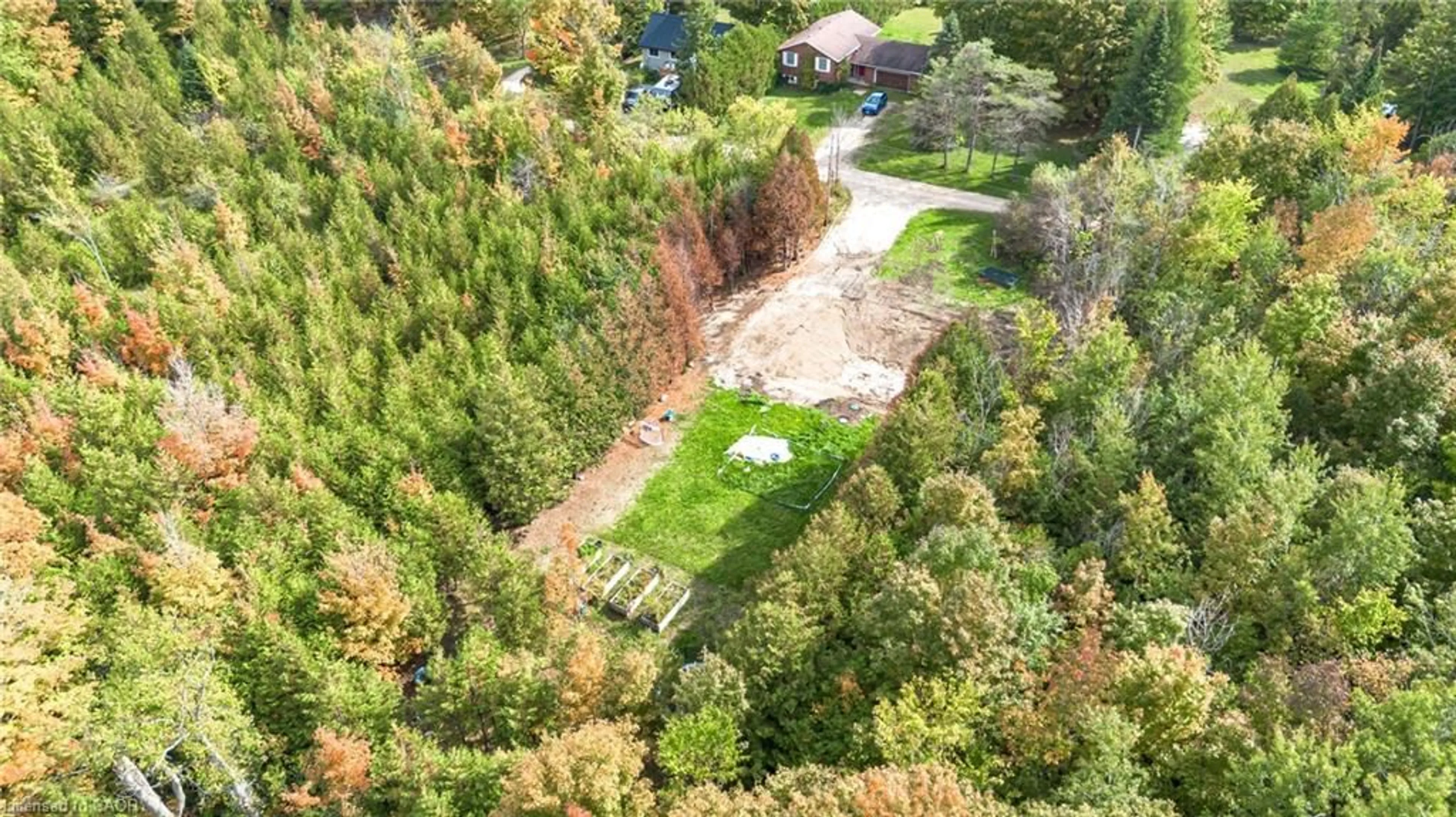 A pic from outside/outdoor area/front of a property/back of a property/a pic from drone, forest/trees view for 135 Sir Williams Lane, Flesherton Ontario N0C 1E0