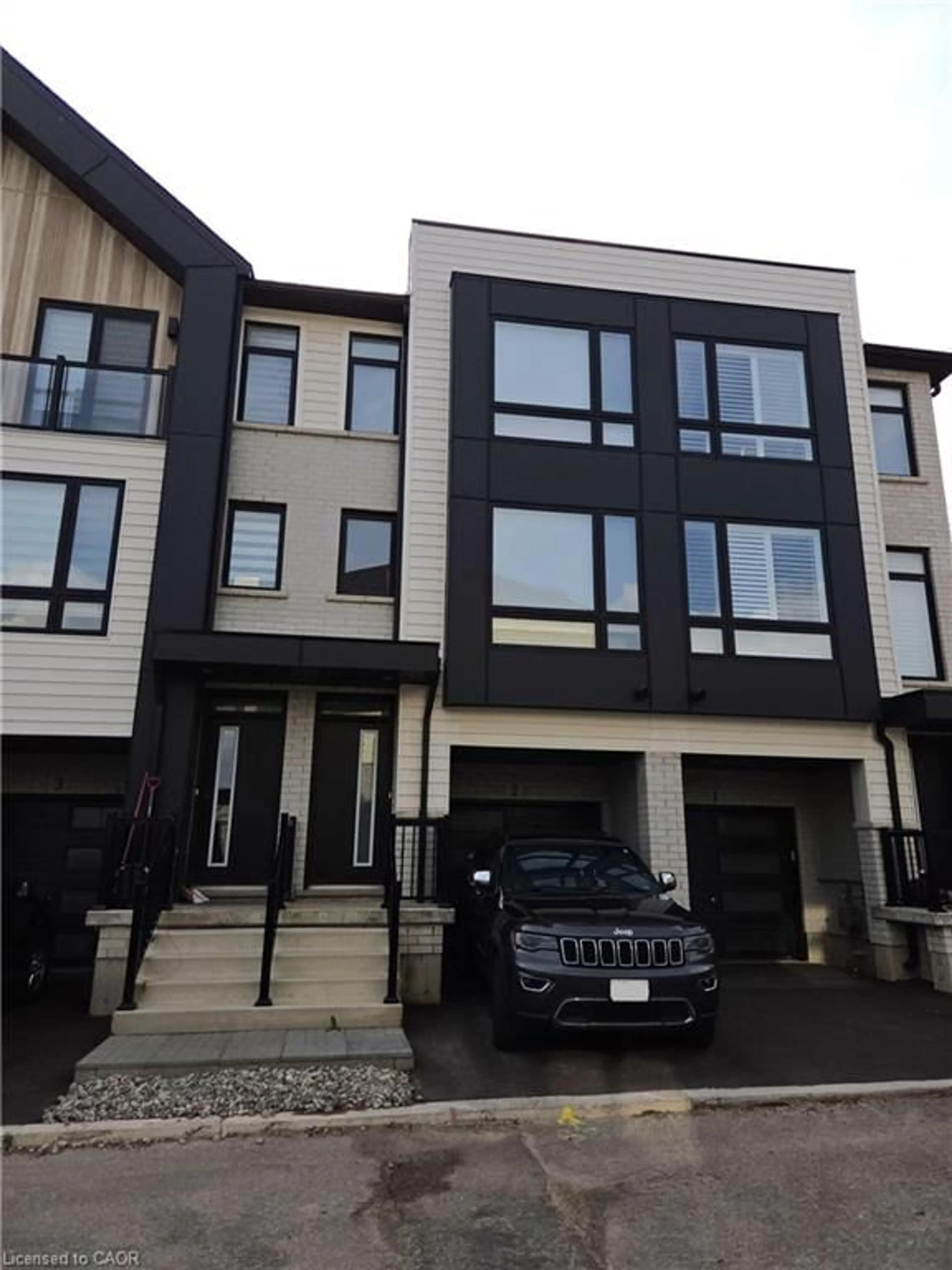 Home with vinyl exterior material, street for 55 Tom Brown Dr #2, Paris Ontario N3L 0N5