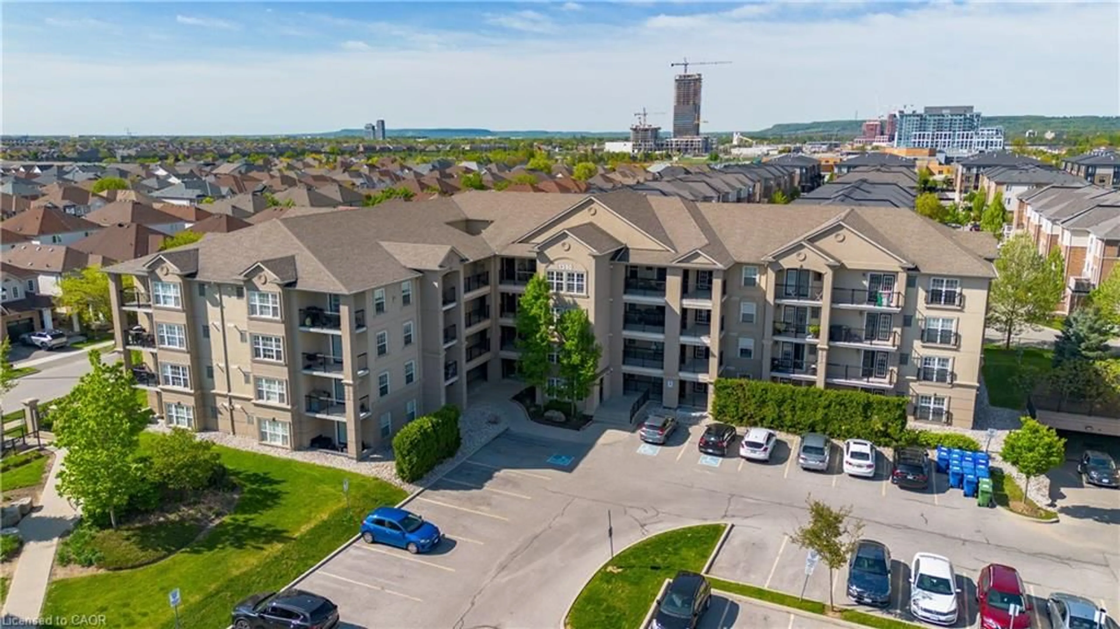 A pic from outside/outdoor area/front of a property/back of a property/a pic from drone, unknown for 1350 Main St #208, Milton Ontario L9T 7S7