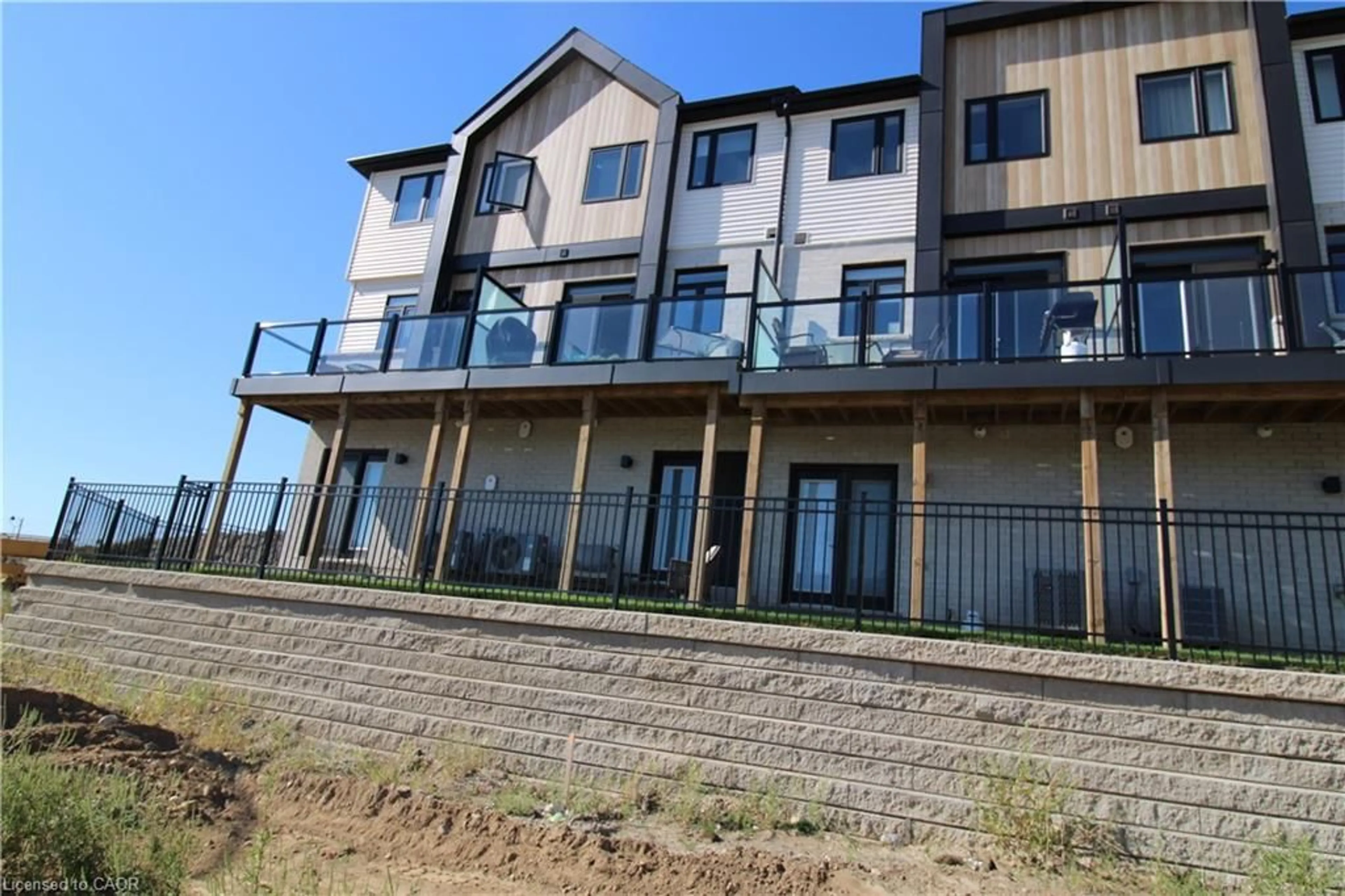 A pic from outside/outdoor area/front of a property/back of a property/a pic from drone, water/lake/river/ocean view for 55 Tom Brown Dr #88, Paris Ontario N3L 0K6