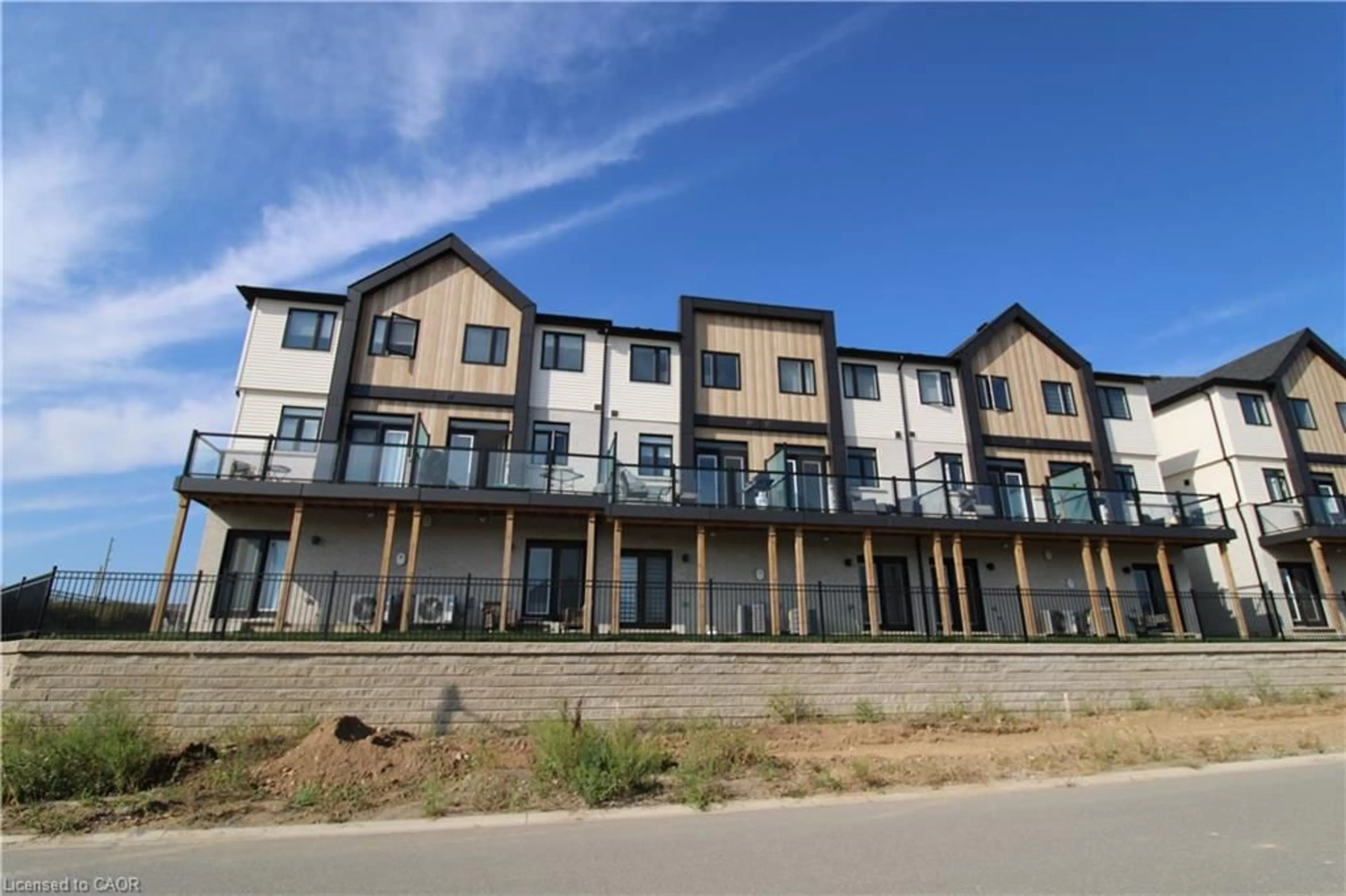 A pic from outside/outdoor area/front of a property/back of a property/a pic from drone, unknown for 55 Tom Brown Dr #91, Paris Ontario N3L 0K6