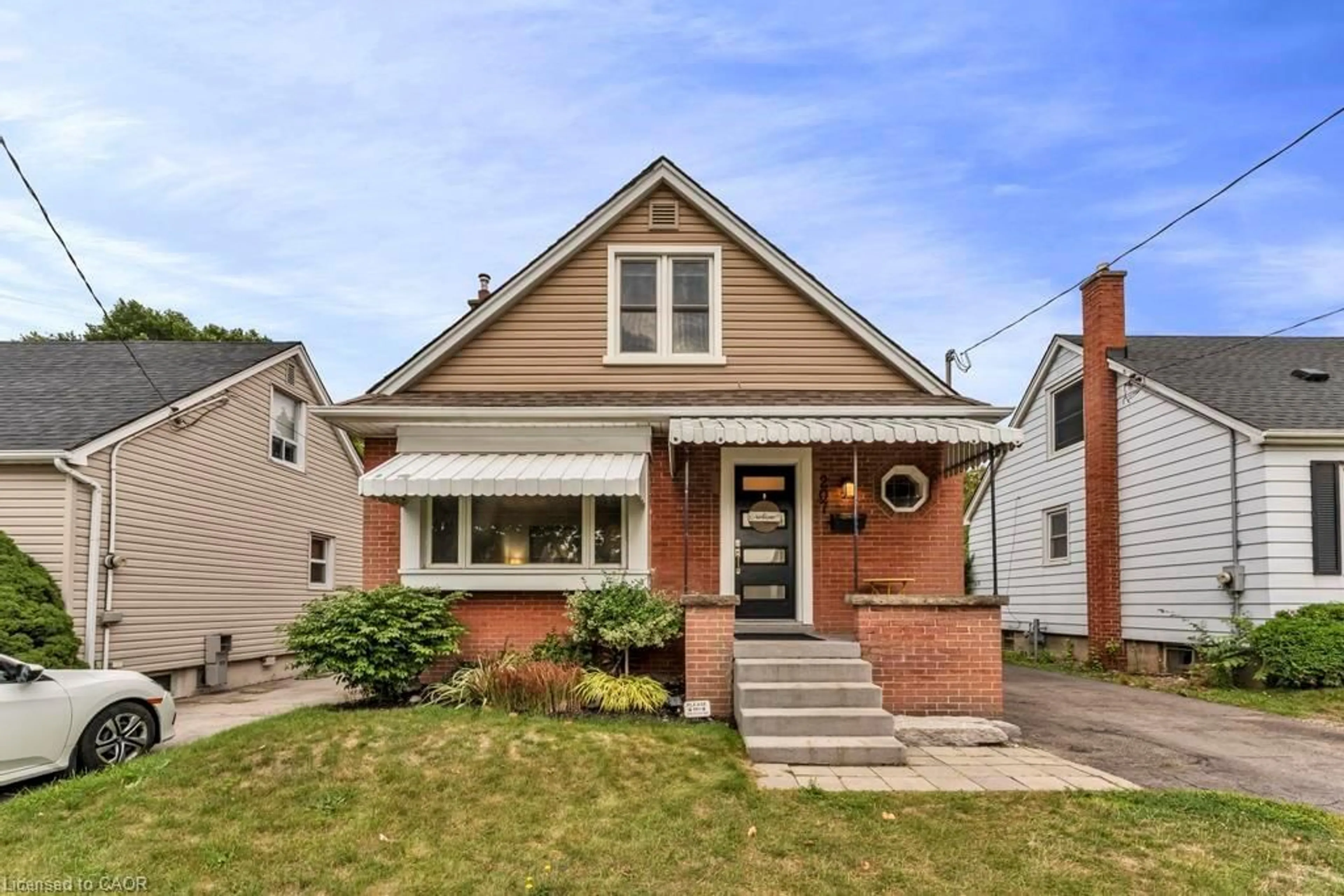 Home with brick exterior material, street for 207 Auburn Ave, Hamilton Ontario L8K 3B4