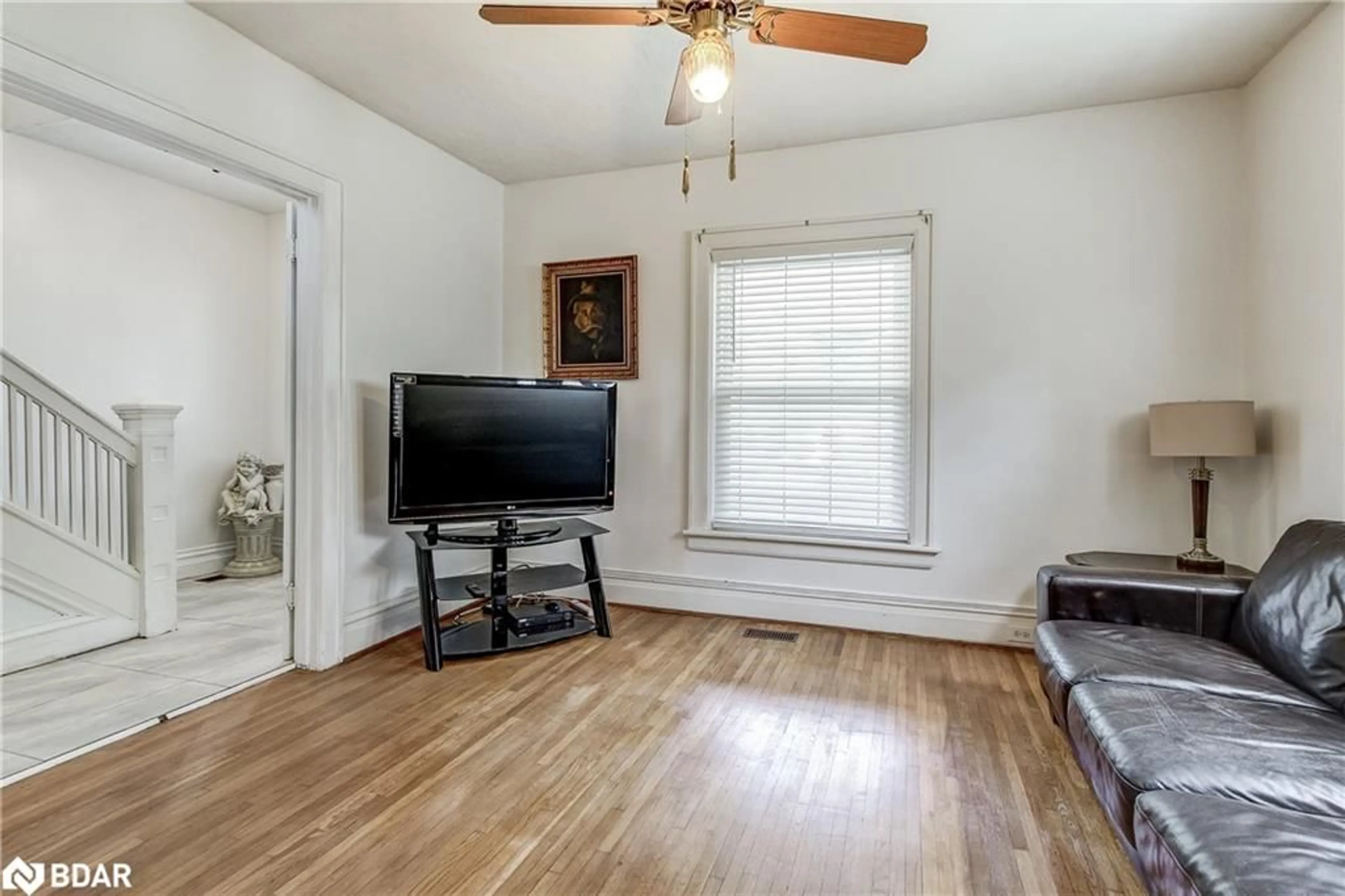 Living room with furniture, wood/laminate floor for 6062 Barker St, Niagara Falls Ontario L2G 1Y4