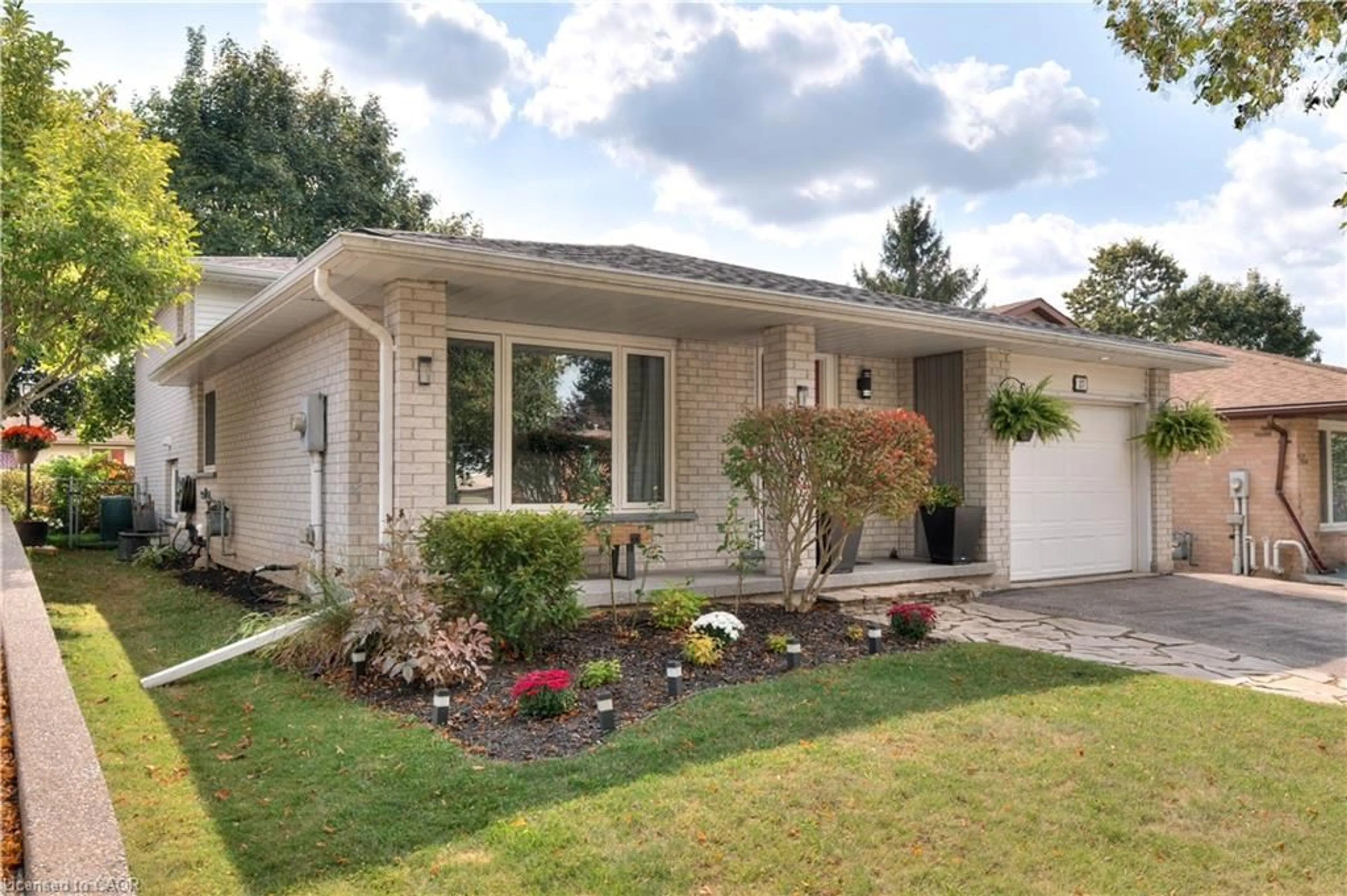 Home with brick exterior material, street for 27 Wheatfield Cres, Kitchener Ontario N2P 1P7