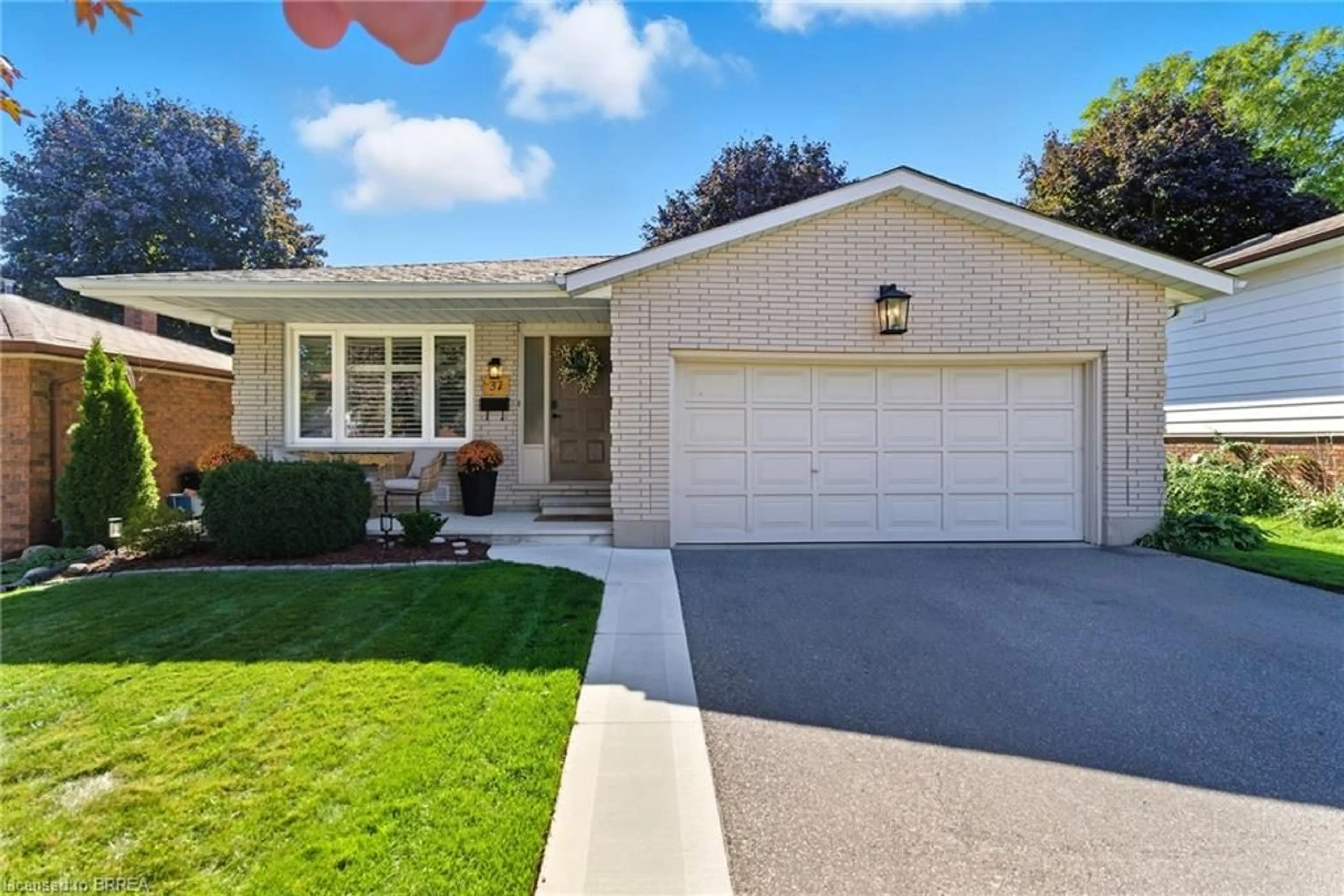 Home with brick exterior material, street for 37 Wildflower Lane, Brantford Ontario N3R 6B3