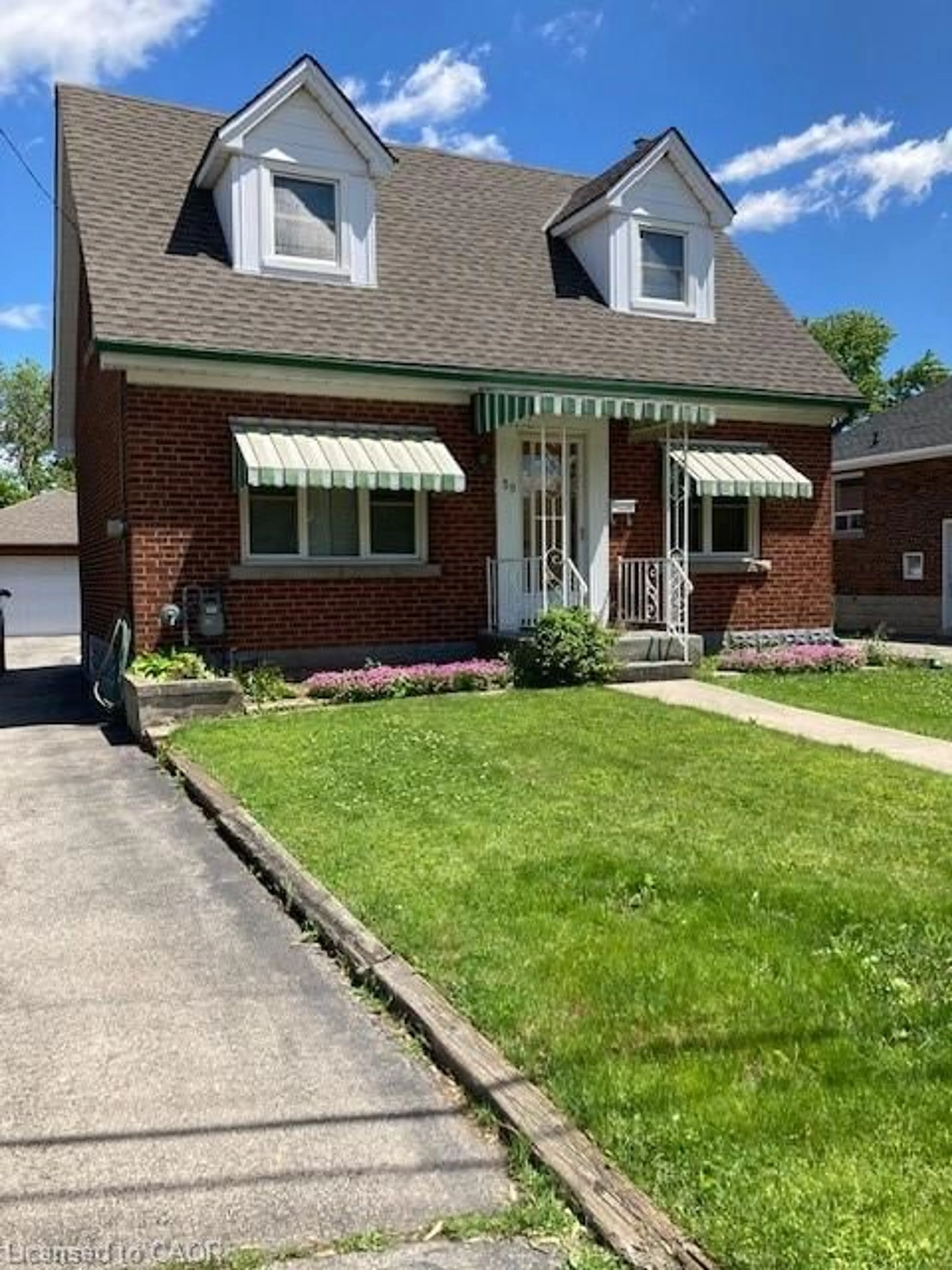 Home with brick exterior material, street for 59 Dunkirk Dr, Hamilton Ontario L8K 4W9