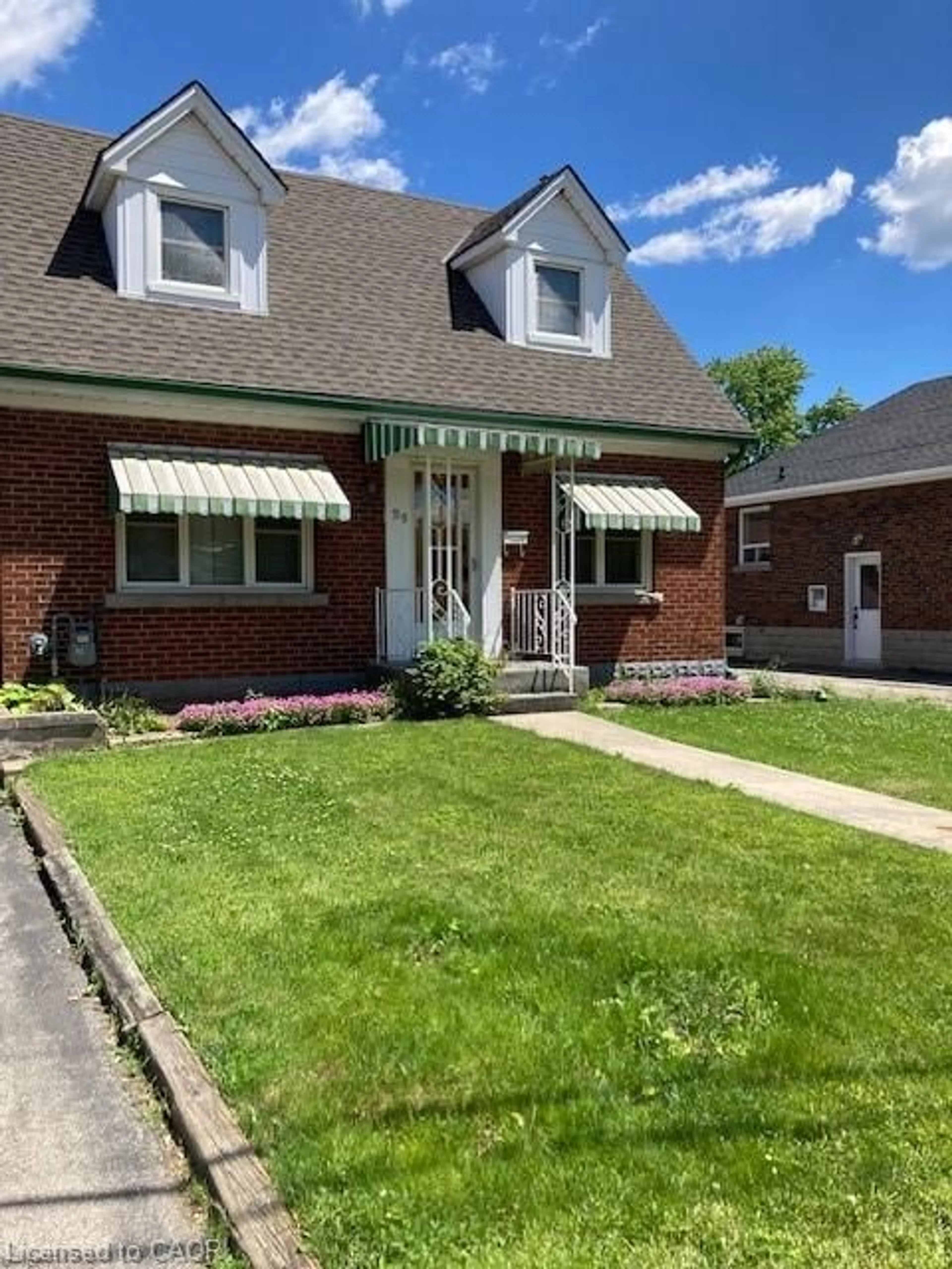 Home with brick exterior material, street for 59 Dunkirk Dr, Hamilton Ontario L8K 4W9