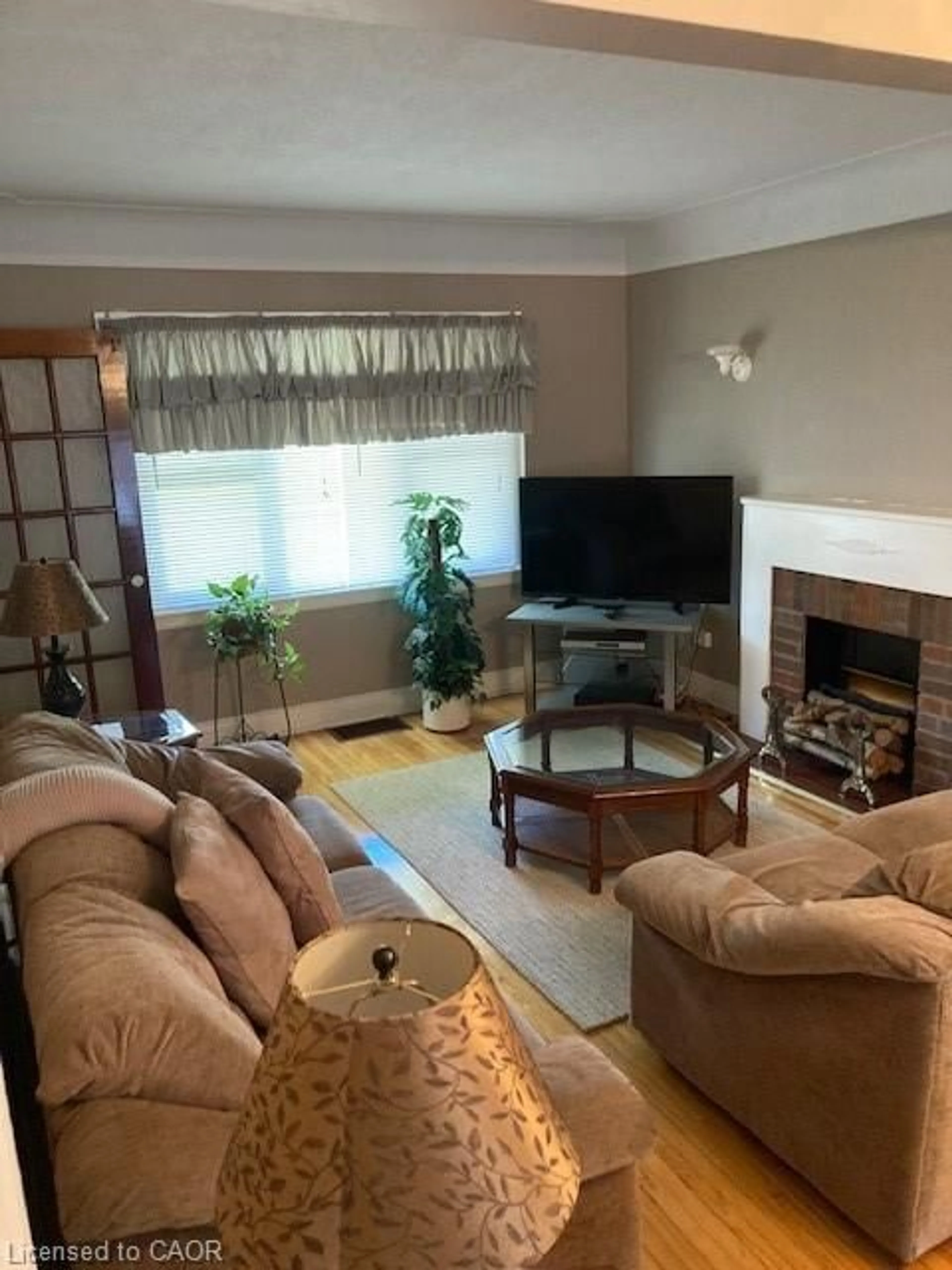 Living room with furniture, wood/laminate floor for 59 Dunkirk Dr, Hamilton Ontario L8K 4W9