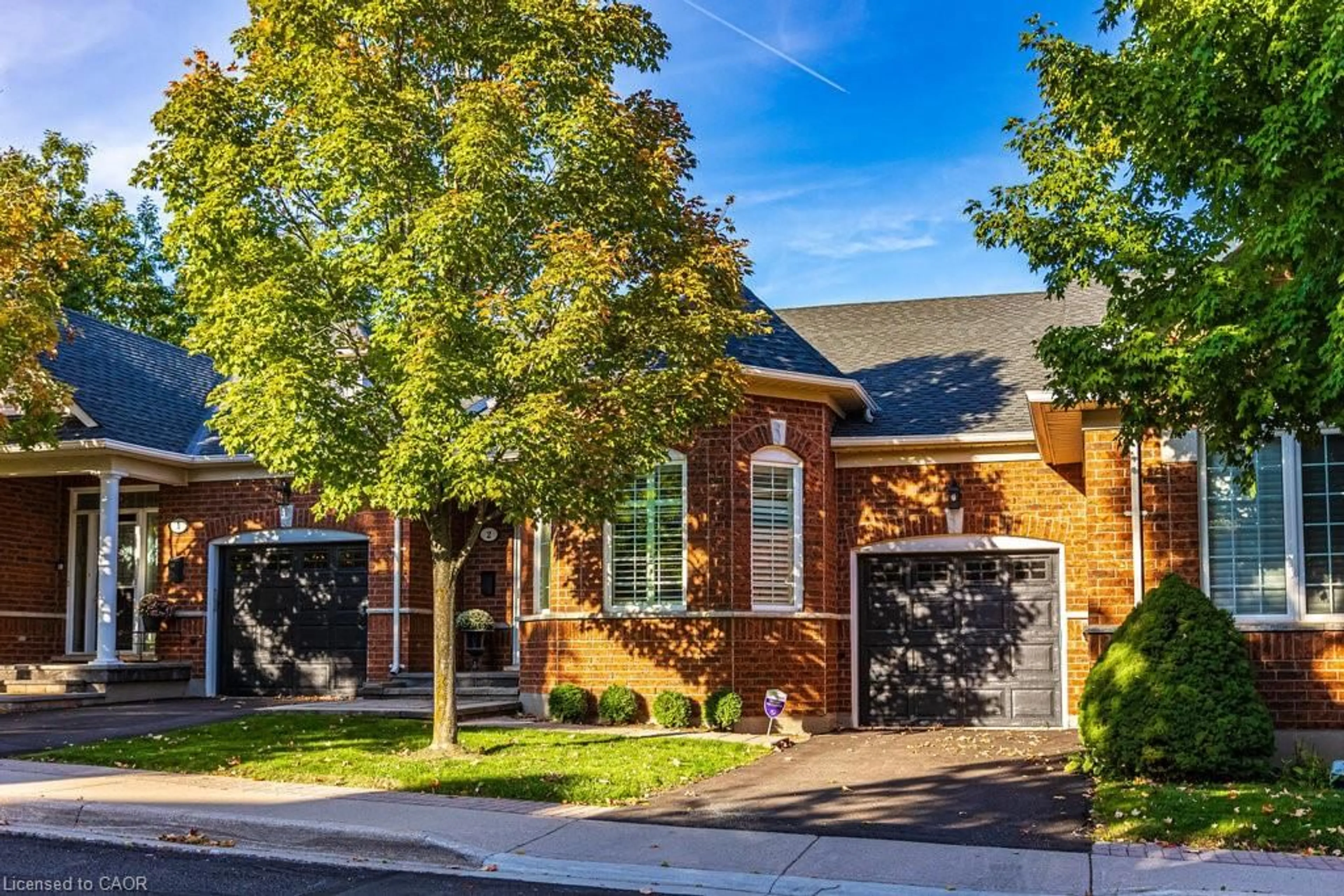 Home with brick exterior material, street for 2590 Carberry Way #2, Oakville Ontario L6M 5G2