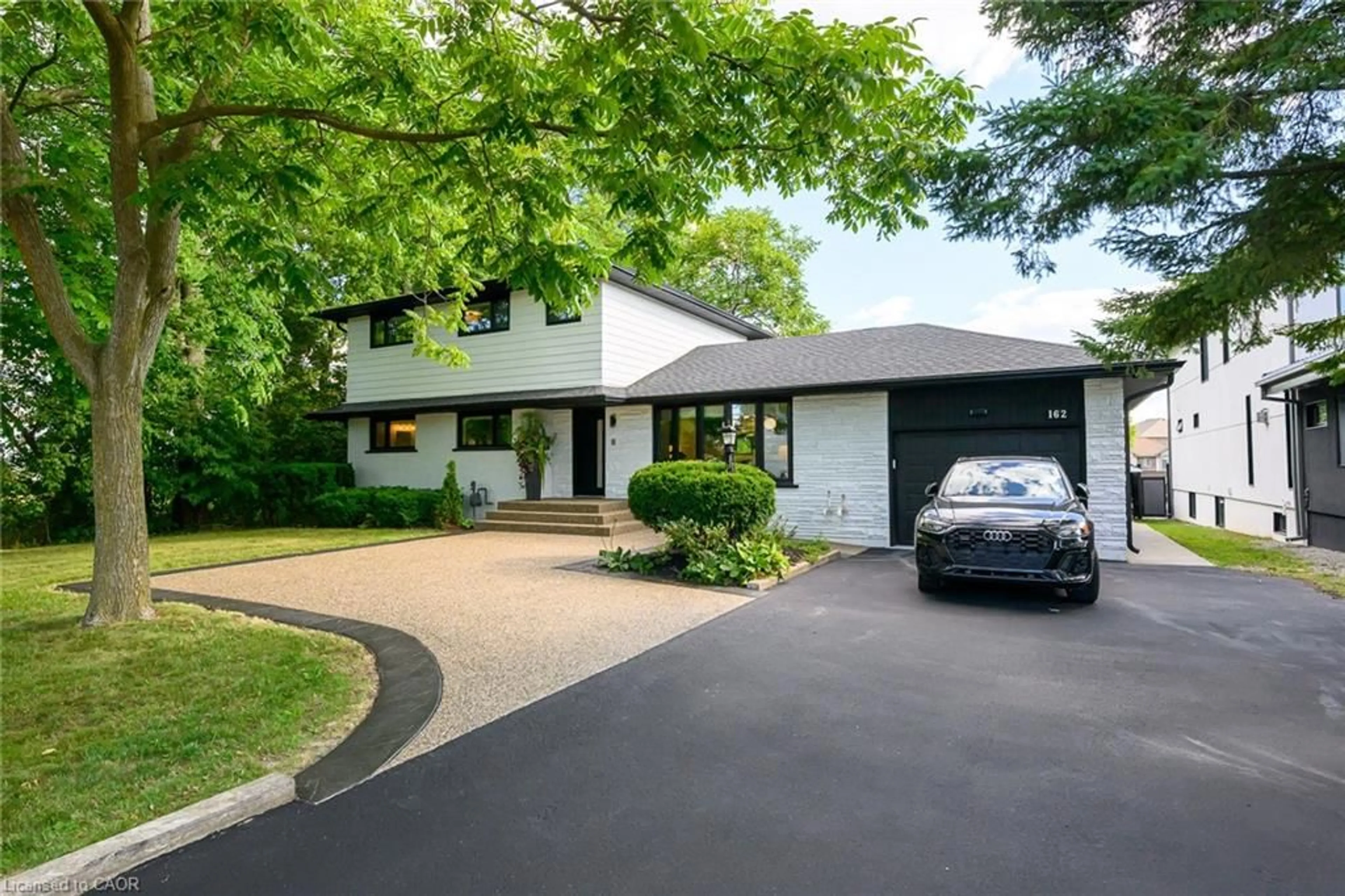 Home with brick exterior material, street for 162 Stone Church Rd, Hamilton Ontario L9B 1A9