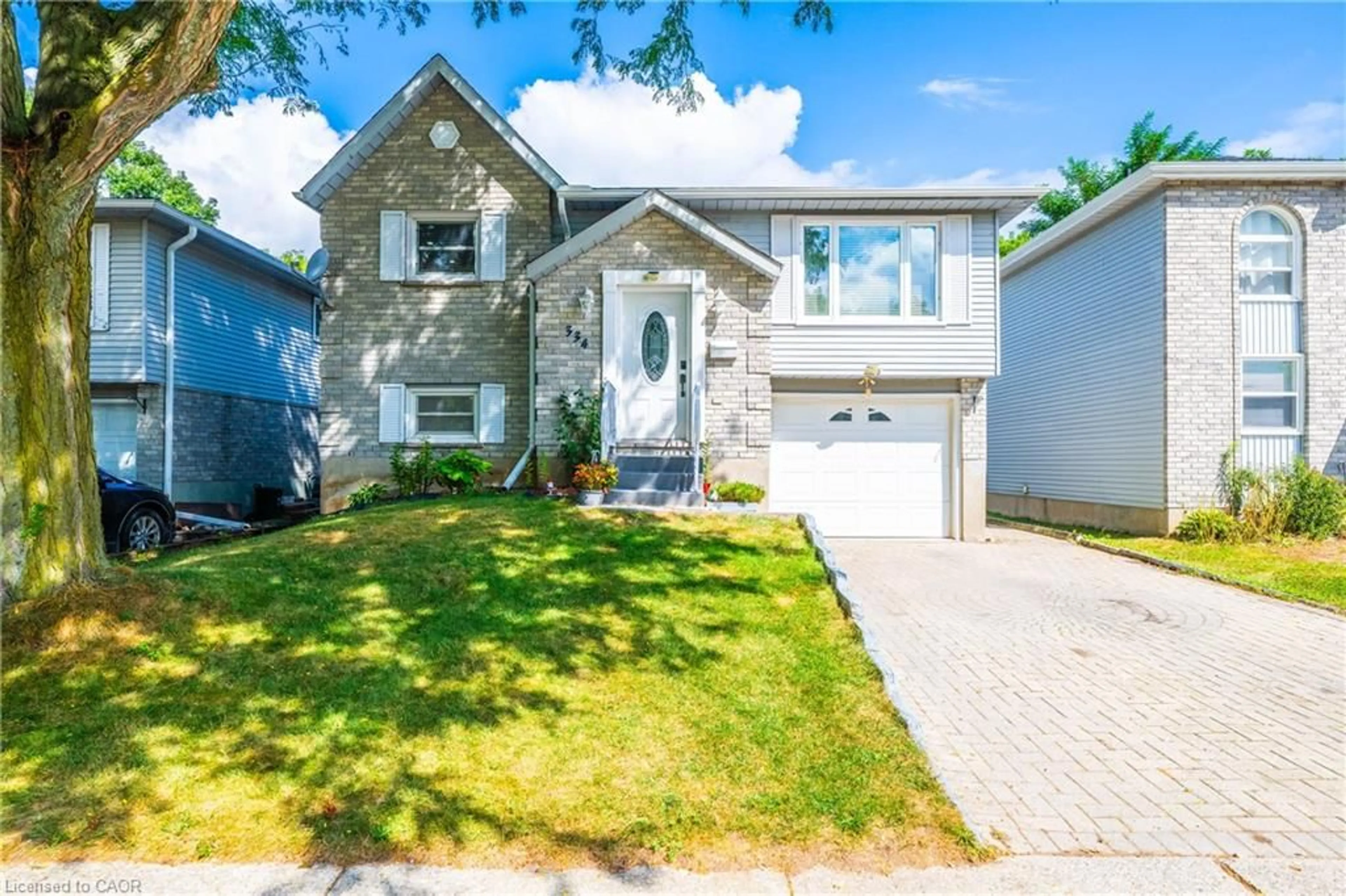 Home with vinyl exterior material, street for 334 Sekura St, Cambridge Ontario N1R 7W3