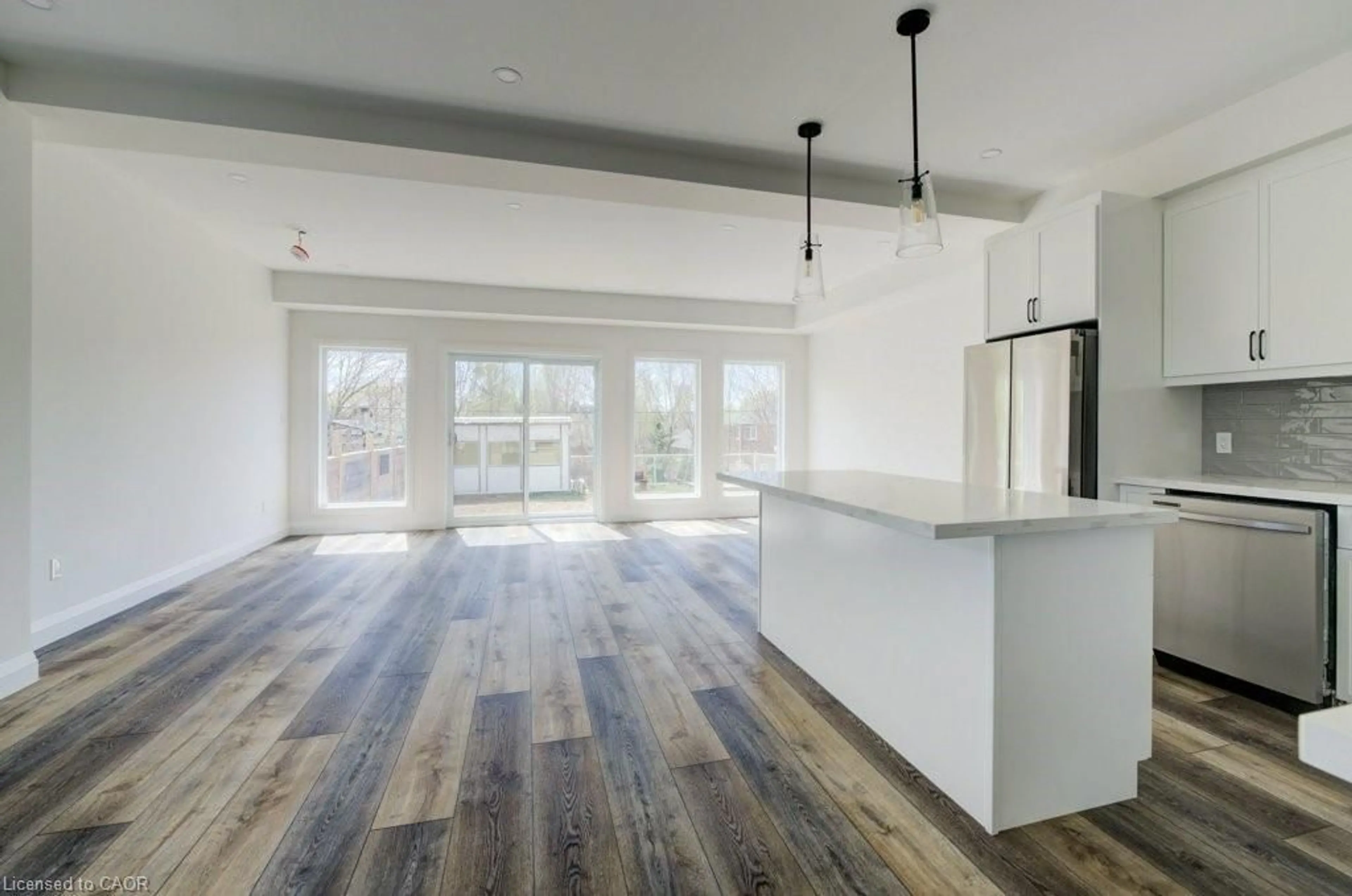 Open concept kitchen, wood/laminate floor for 575 Guelph St, Kitchener Ontario N2H 5Y2