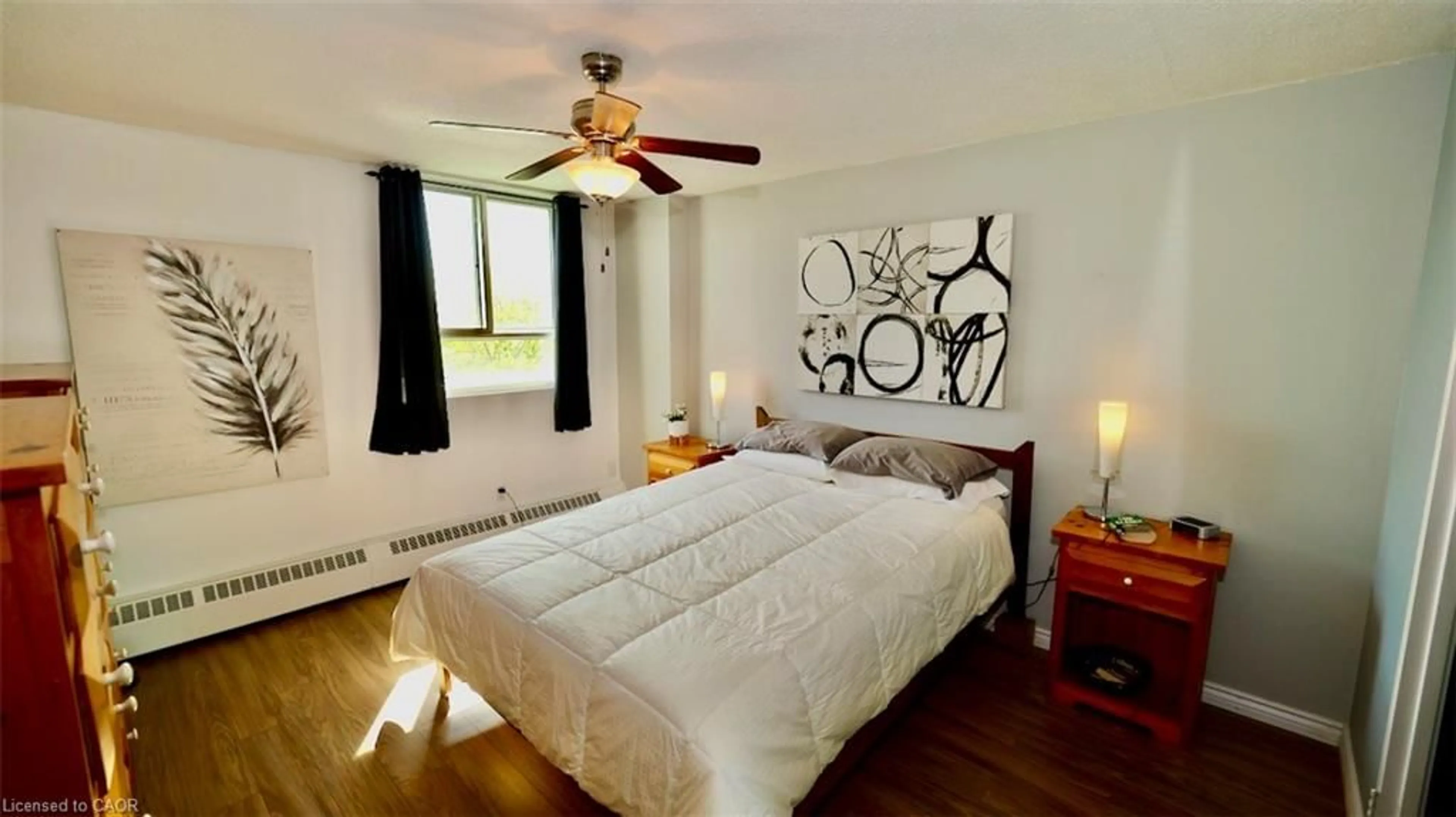 Bedroom with bed, wood/laminate floor for 225 Harvard Pl #603, Waterloo Ontario N2J 4H4