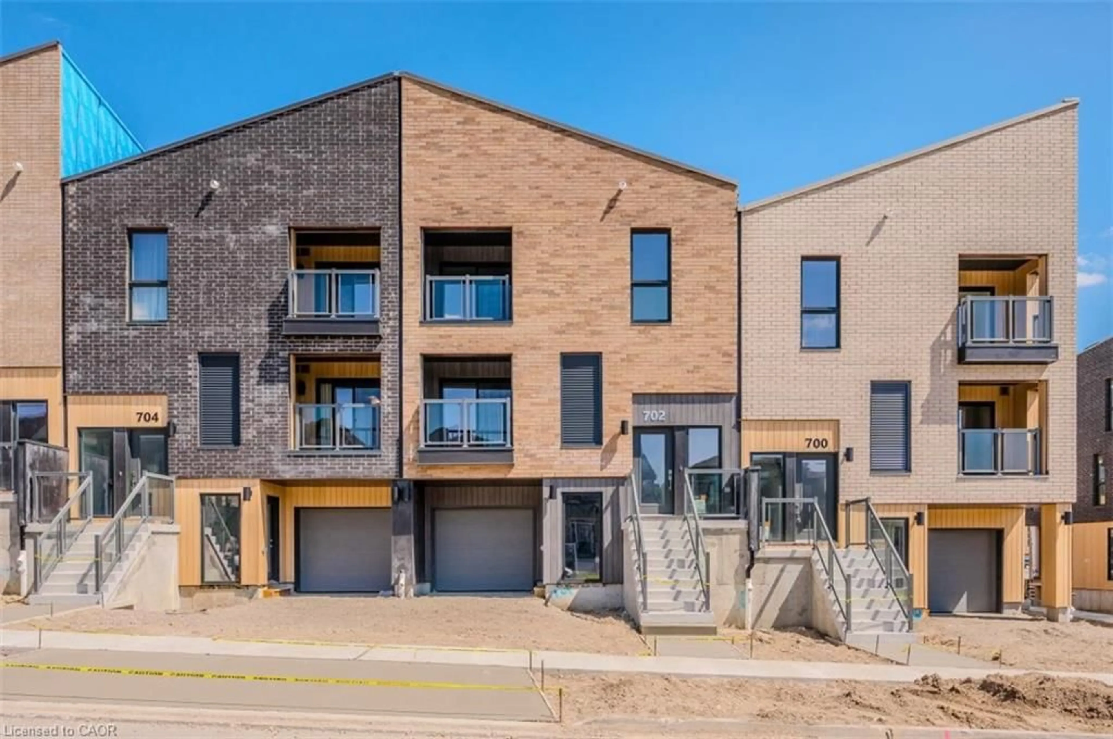 Home with brick exterior material, street for 704 Benninger Dr, Kitchener Ontario N2E 0H8