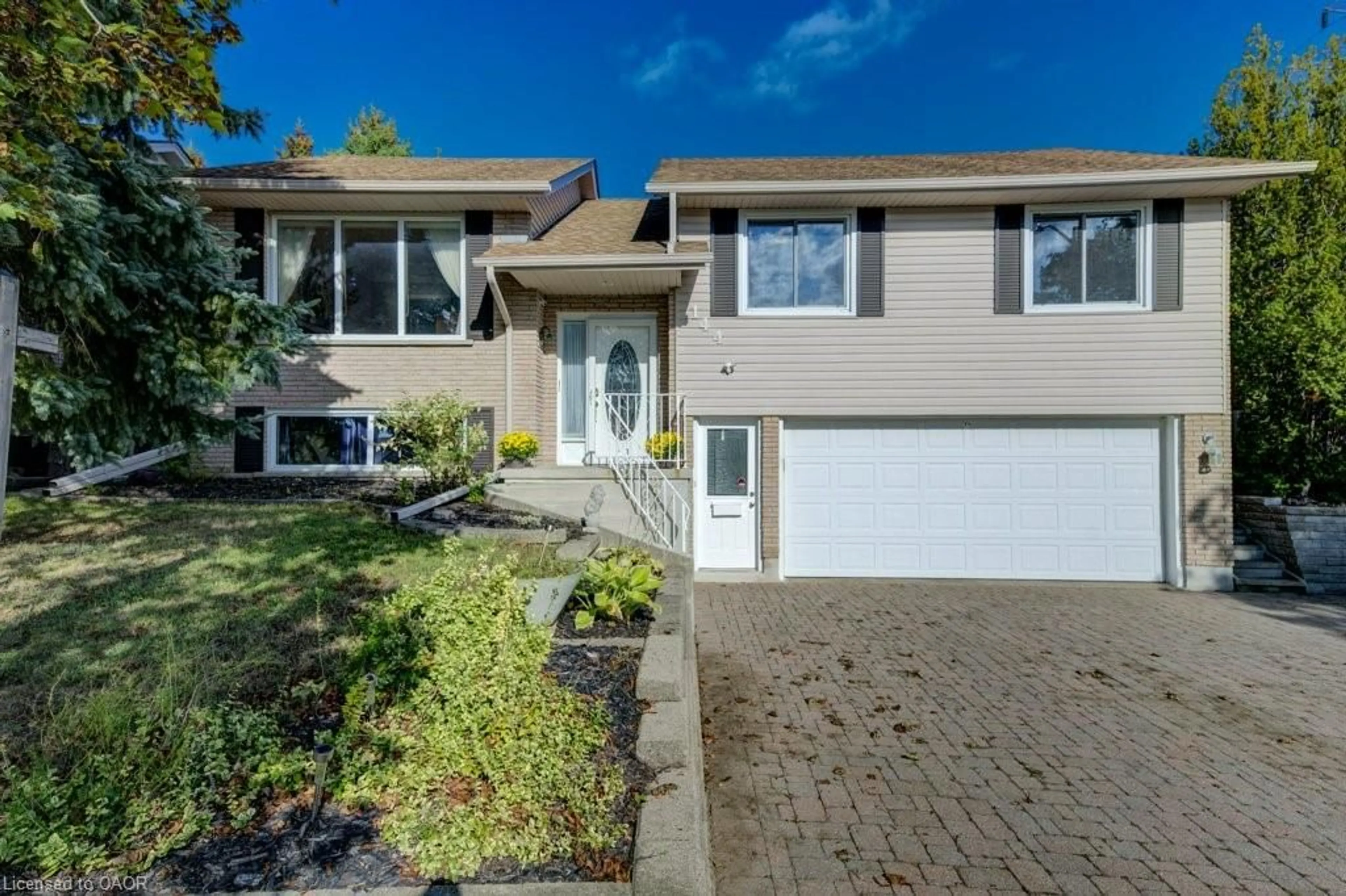 Home with vinyl exterior material, street for 144 Laurentian Dr, Kitchener Ontario N2E 2M3