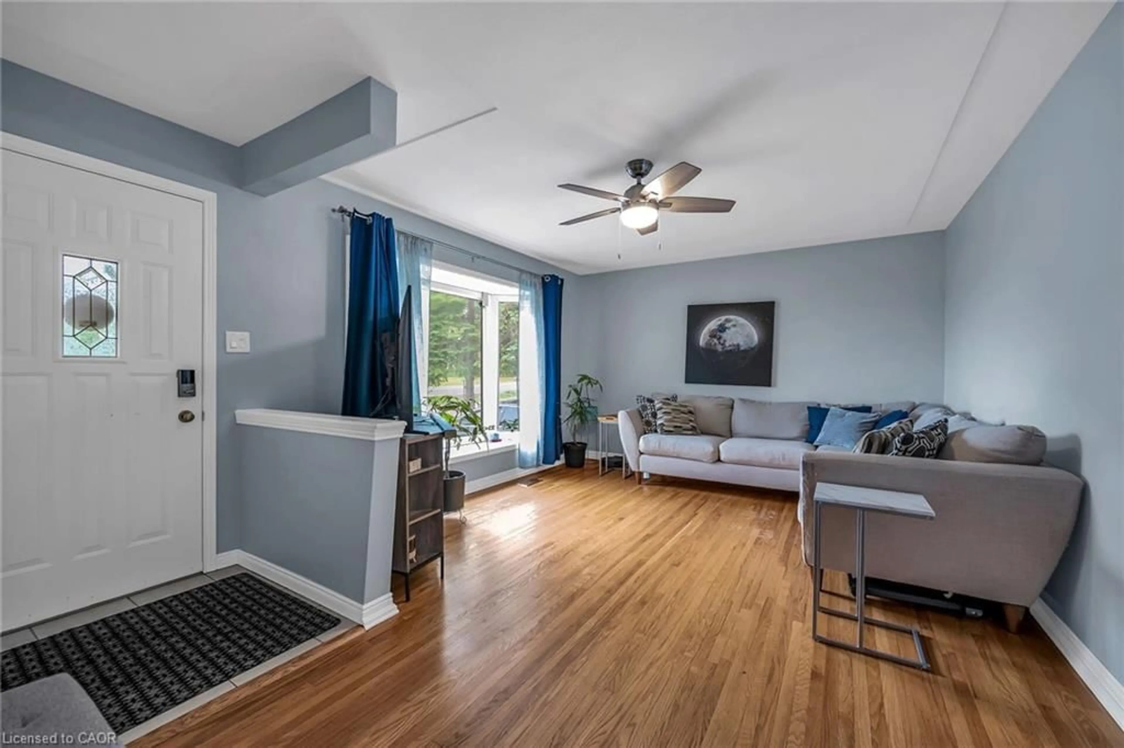 Living room with furniture, wood/laminate floor for 5111 White Church Rd, Mount Hope Ontario L0R 1W0